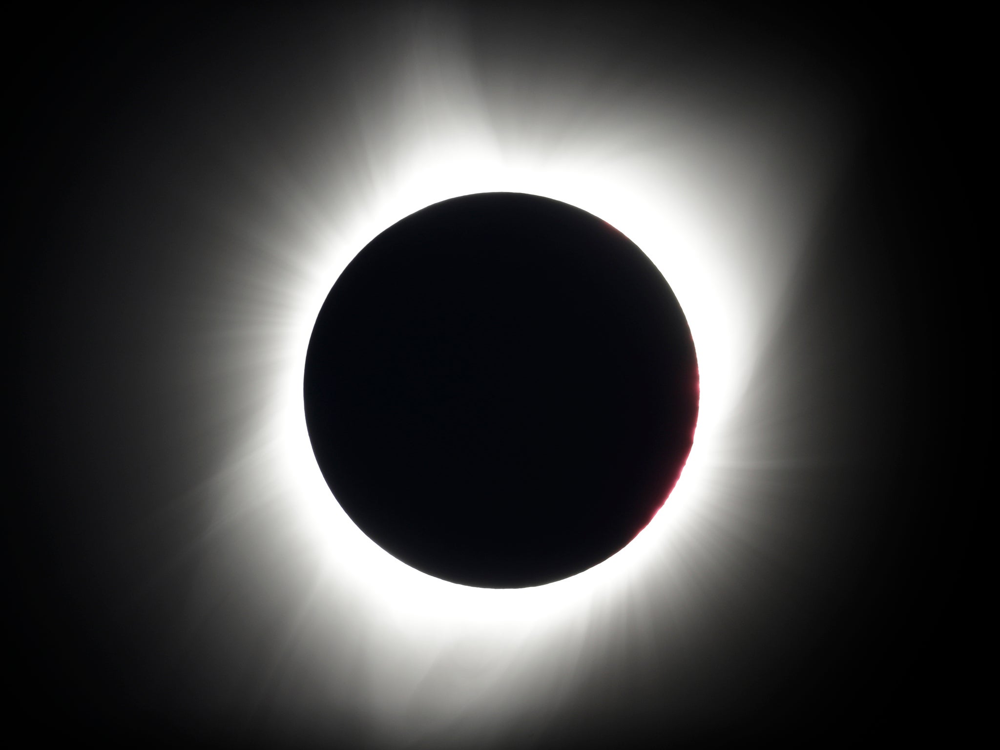 The moon covers the sun during a total eclipse