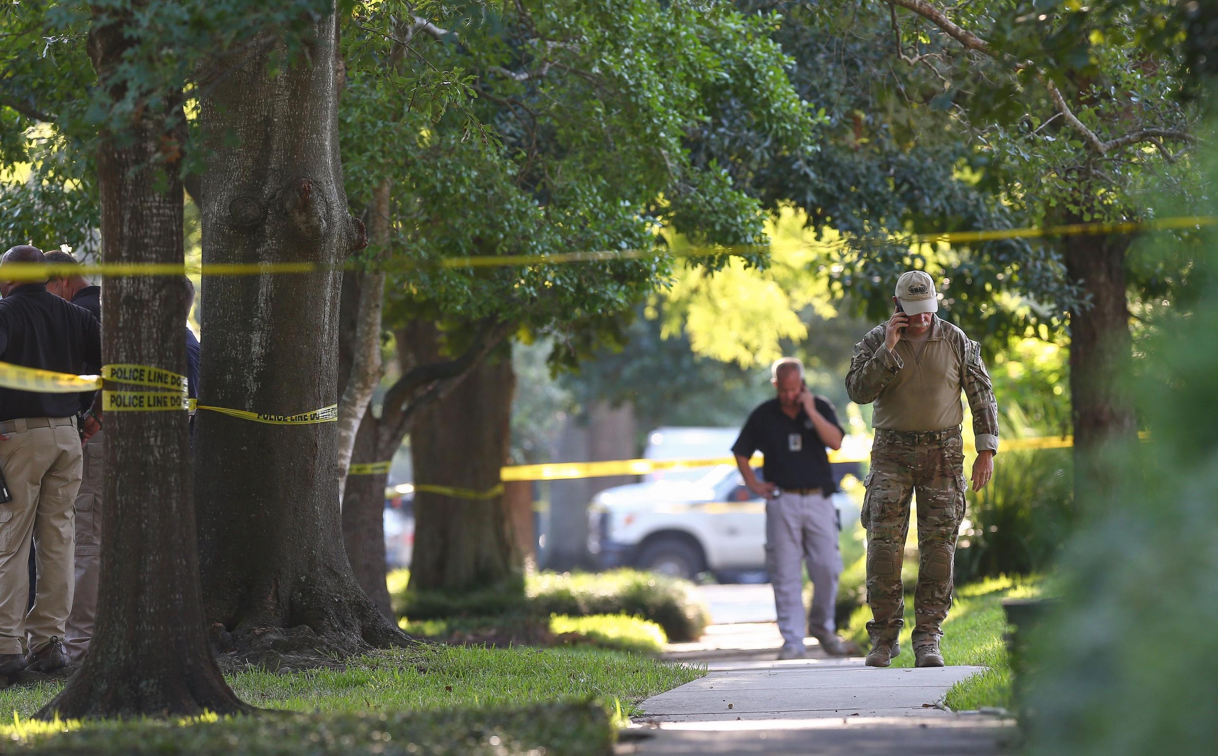 FBI, Bureau of Alcohol, Tobacco, Firearms and Explosives, and Houston Police work at the scene of a "law enforcement operation" led by the FBI in Houston