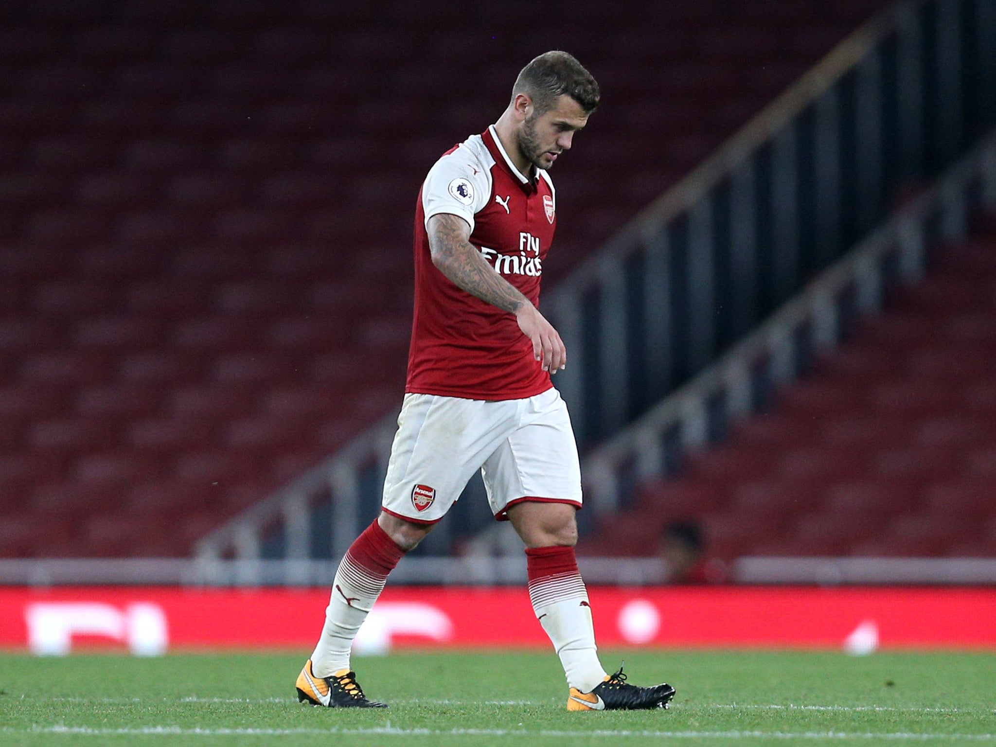 Wilshere walks off the field before getting involved in a tunnel altercation with Tyreke Wilson