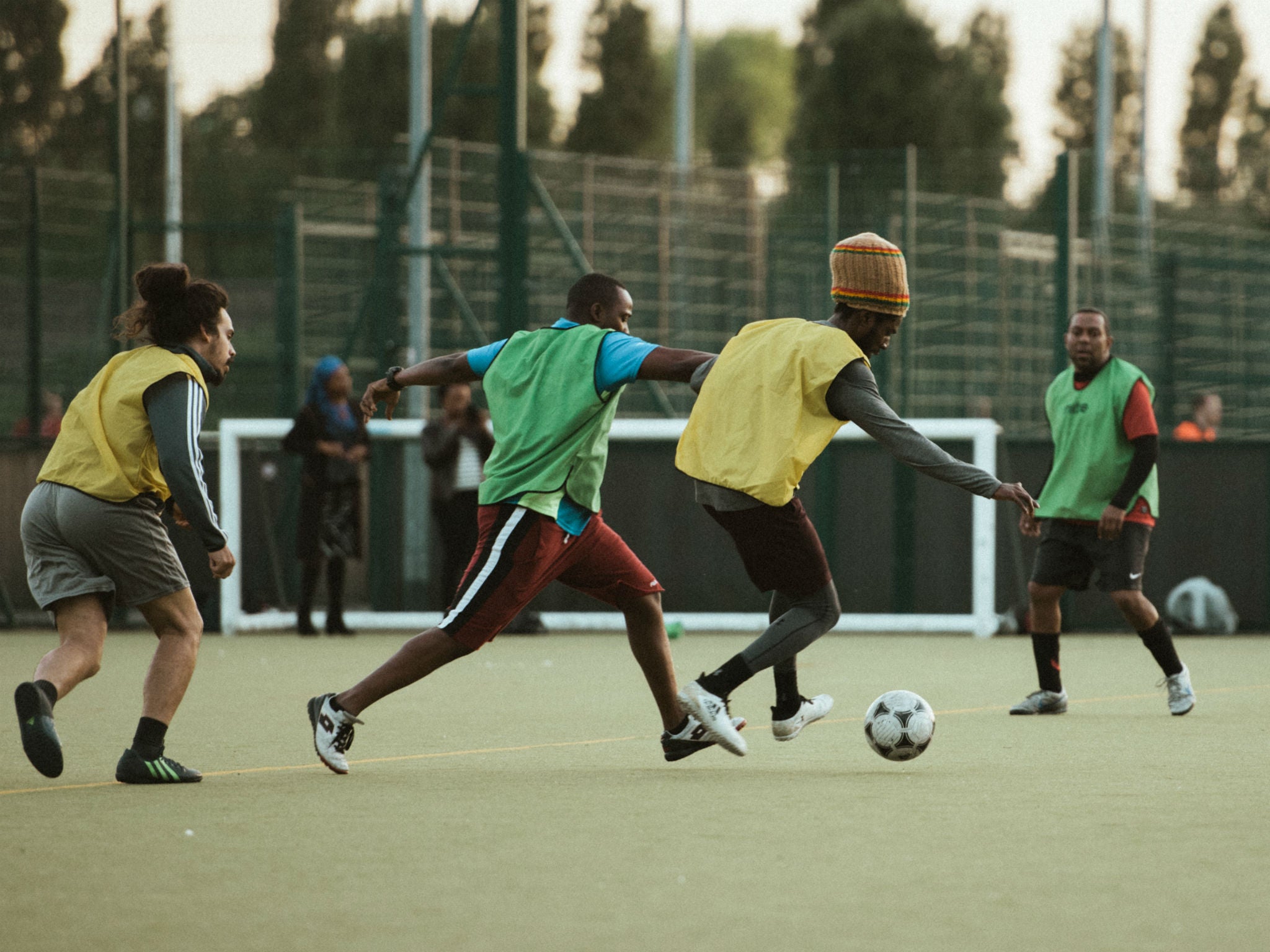 Like Bob Marley, Chronixx is a keen footballer (centre) and supports Arsenal