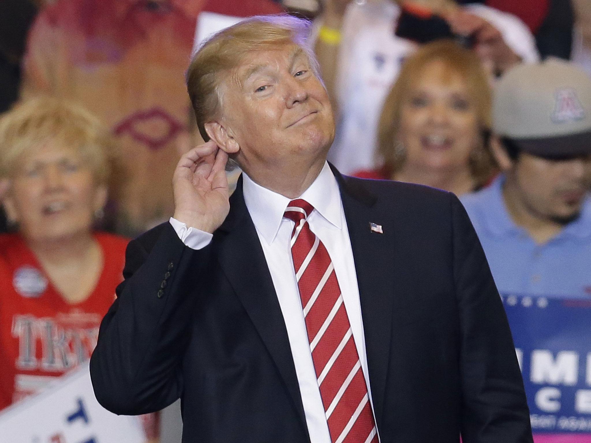 Mr Trump revving up supporters at the Phoenix Convention Center (AP/Rick Scuter)