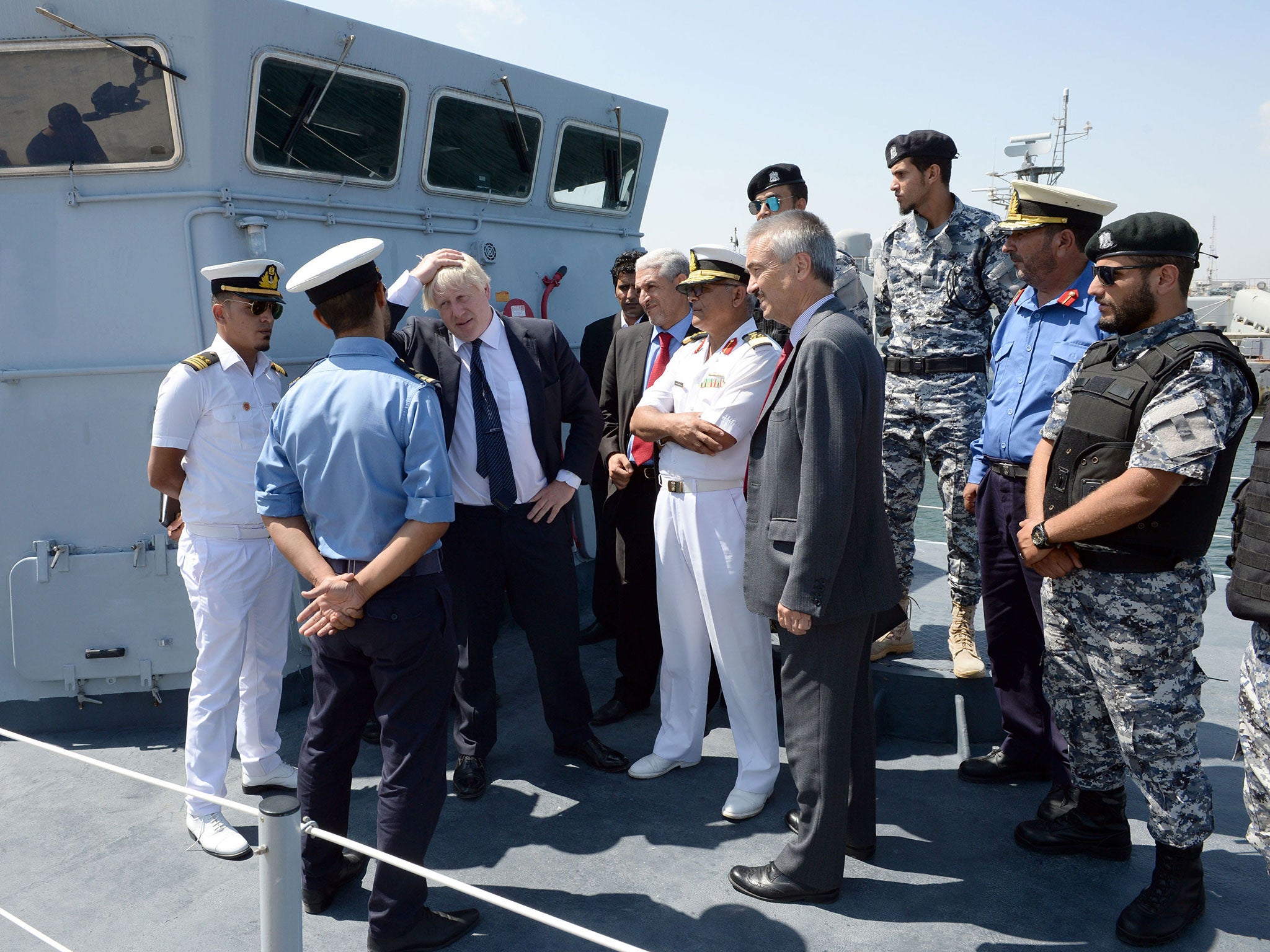 Boris Johnson meets members of the Libyan coastguard at a naval base in Tripoli