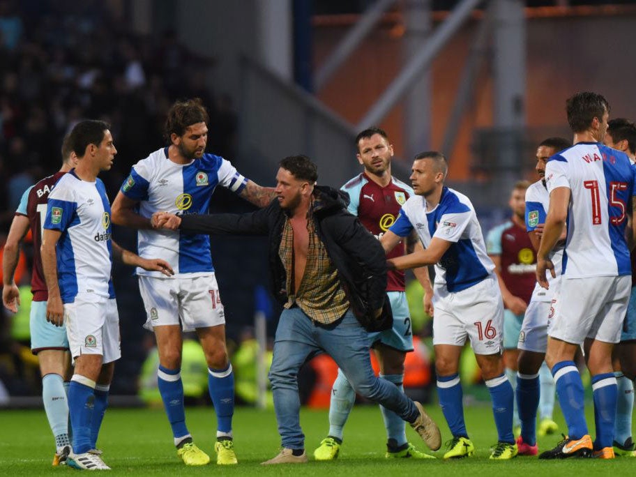 Five were arrested at Blackburn after fans invaded the pitch and attacked players