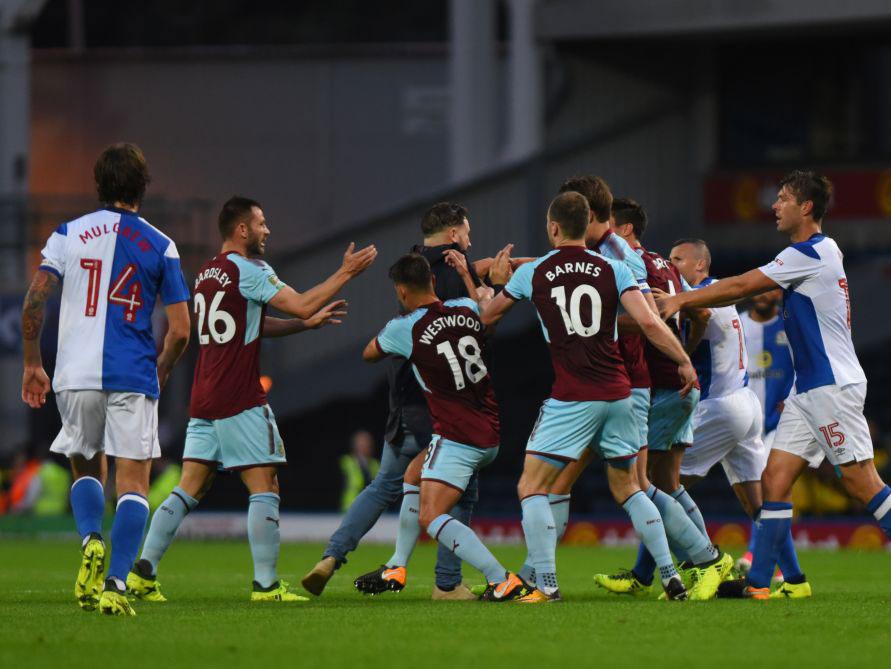 A fan tris to attack Burnley players after Cork's opening goal