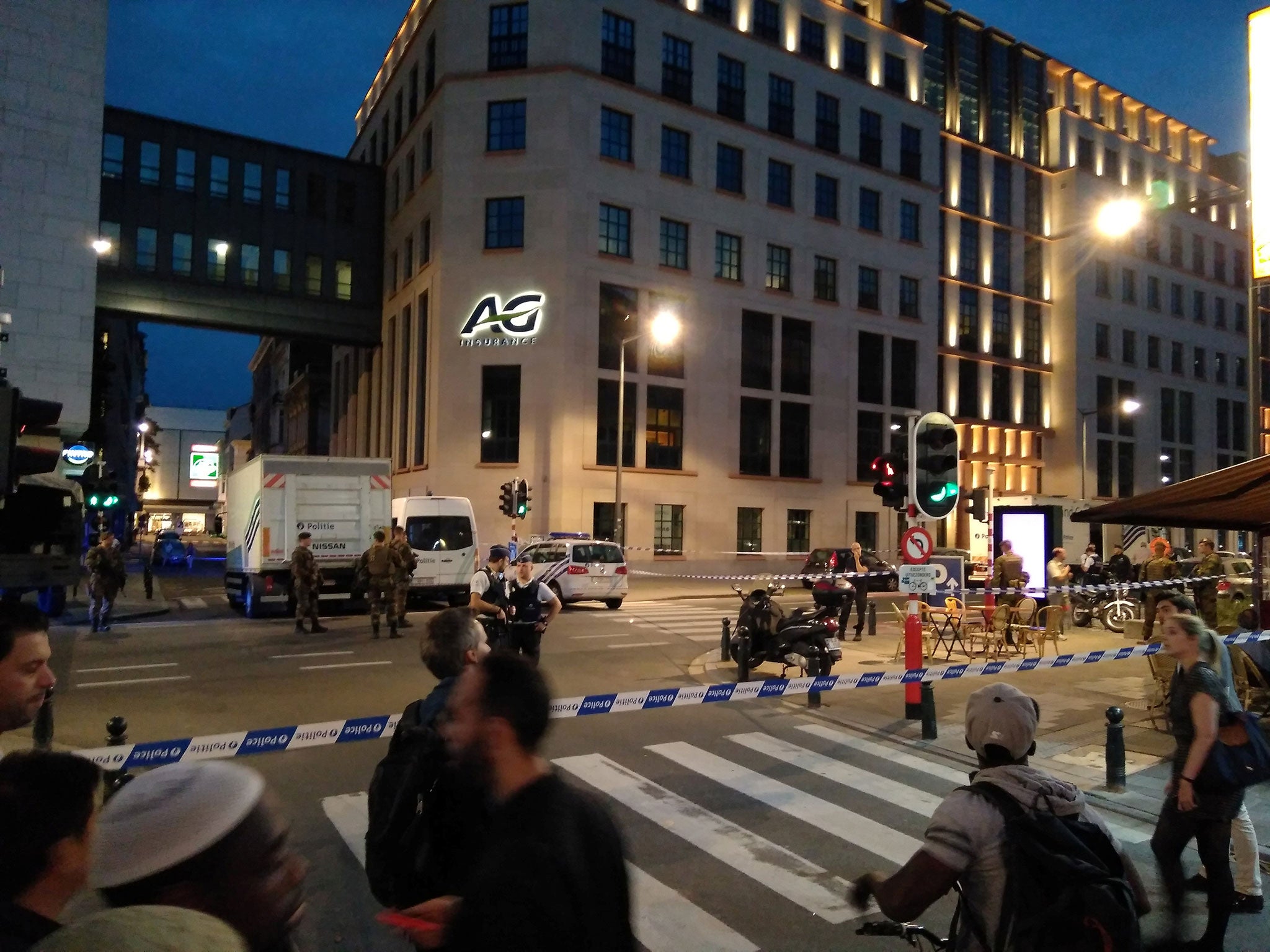 Belgian police and soldiers at the scene where a man attacked soldiers with a knife in Brussels on 25 August