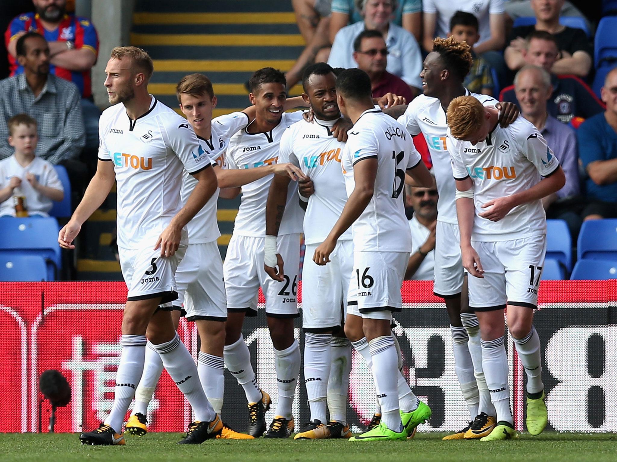 Swansea scored their first goals of the season to get their first win