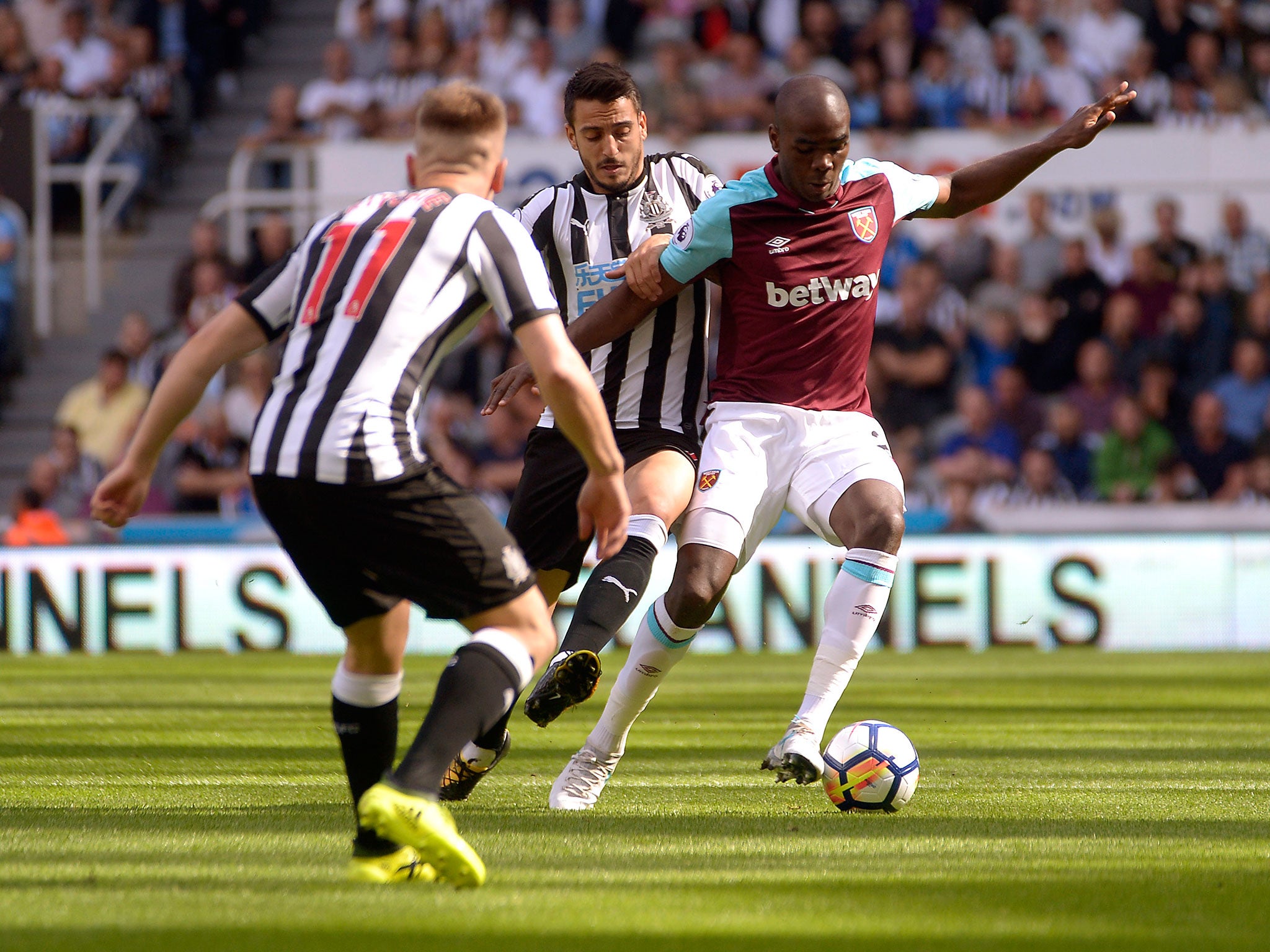 Angelo Ogbonna attempts to get away from Matt Ritchie