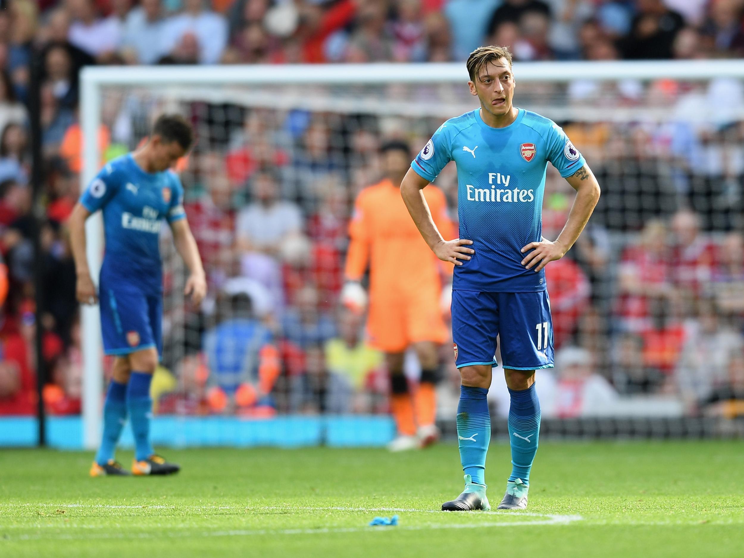 Arsenal's players react during their 4-0 humiliation