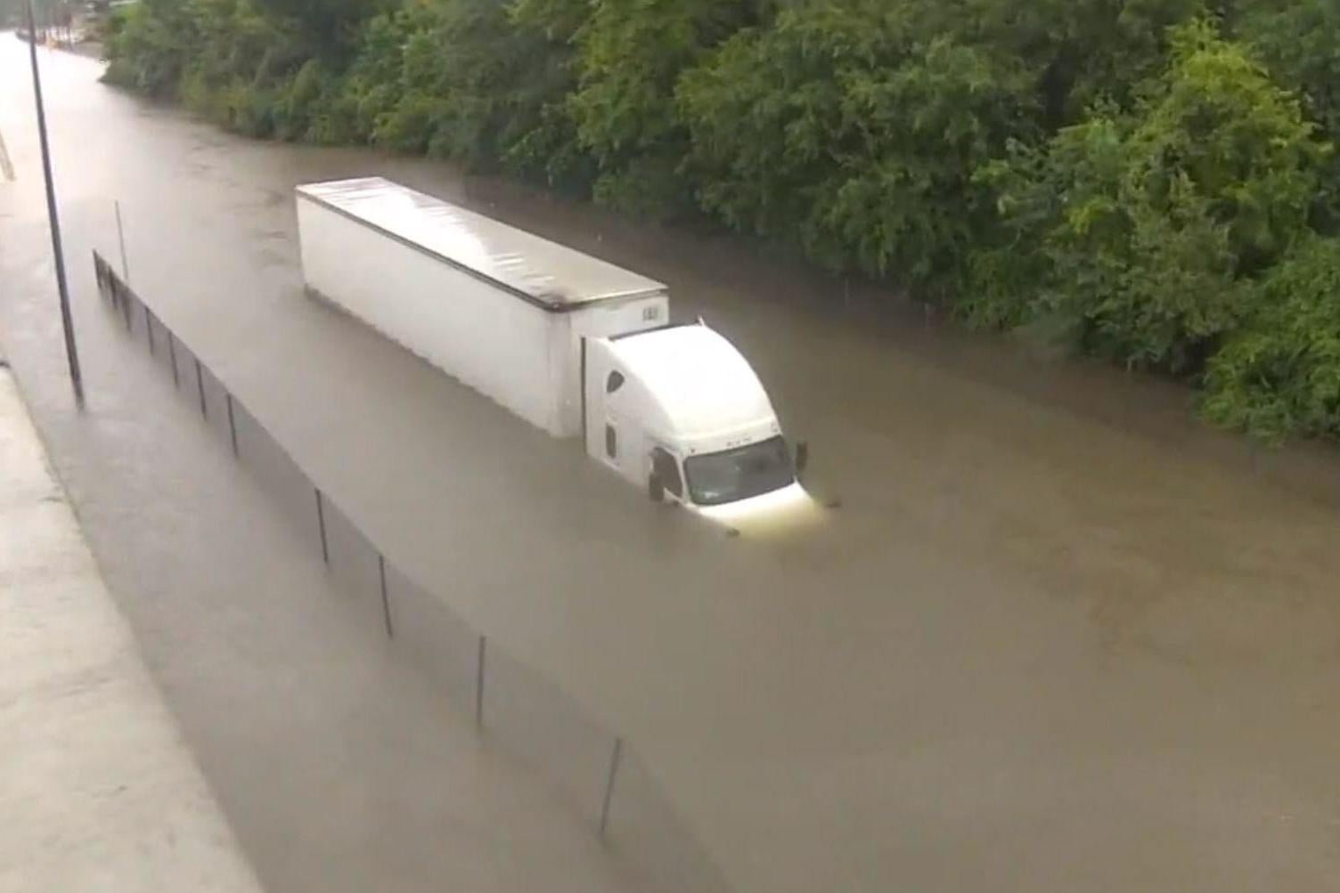 The lorry stalled in at least 10ft of floodwater in Houston