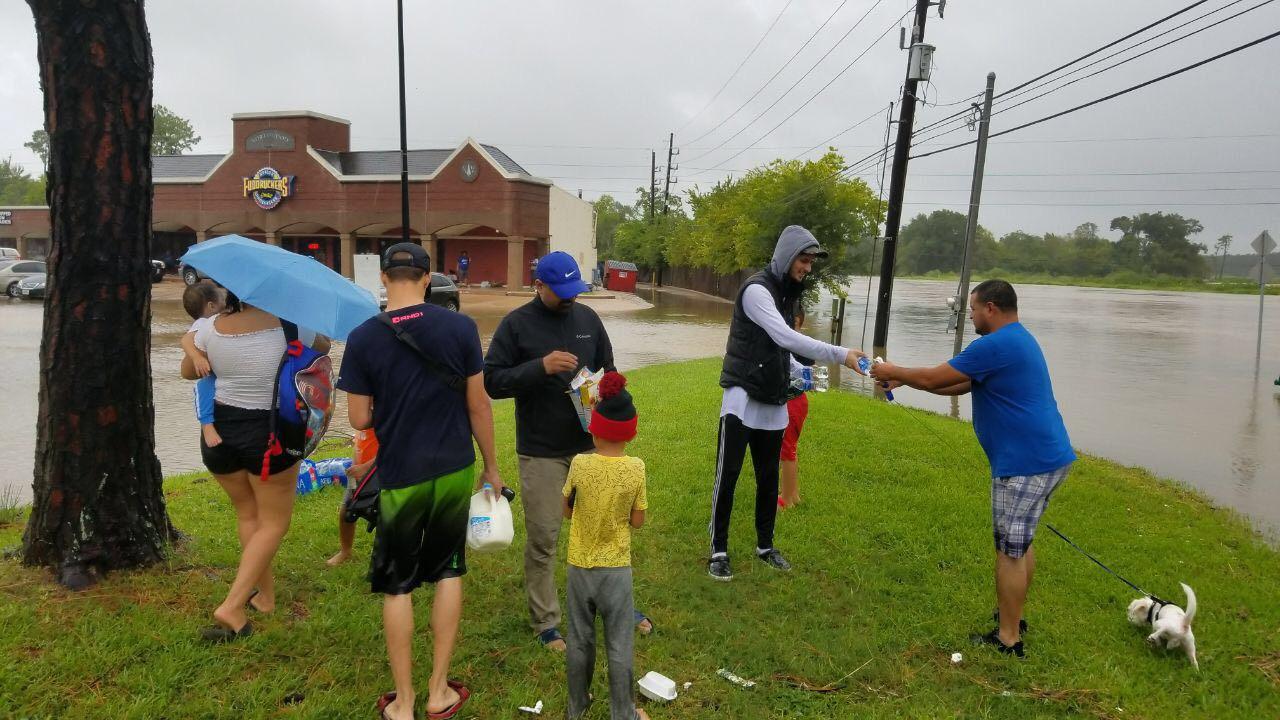 Volunteers pass out supplies in Houston during tropical storm Harvey