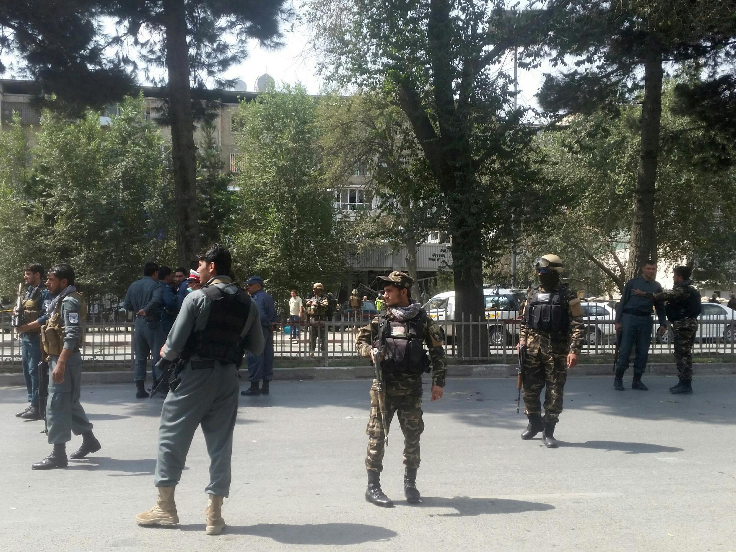 Afghan security forces keep watch at the site of attack in Kabul