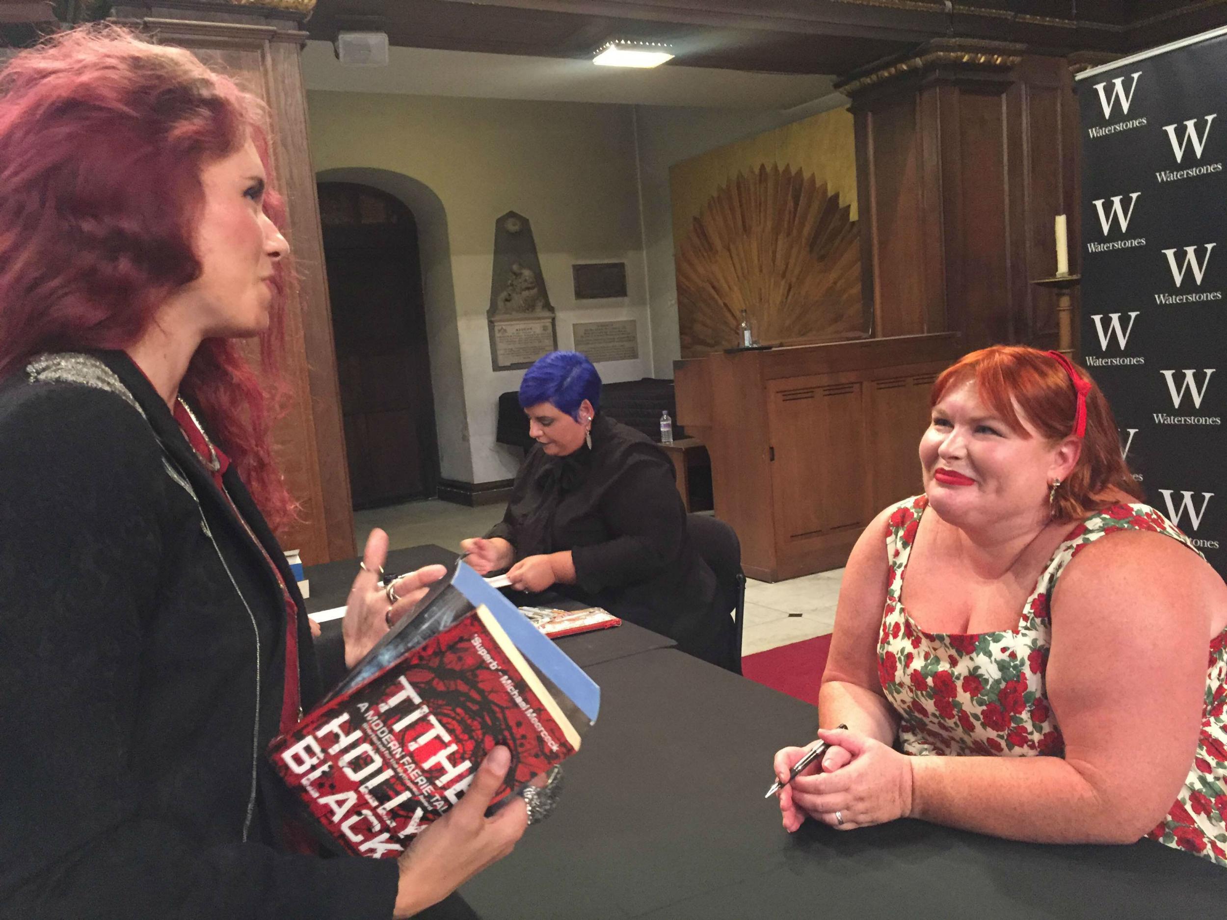 Clare with a reader, during a fan signing in London