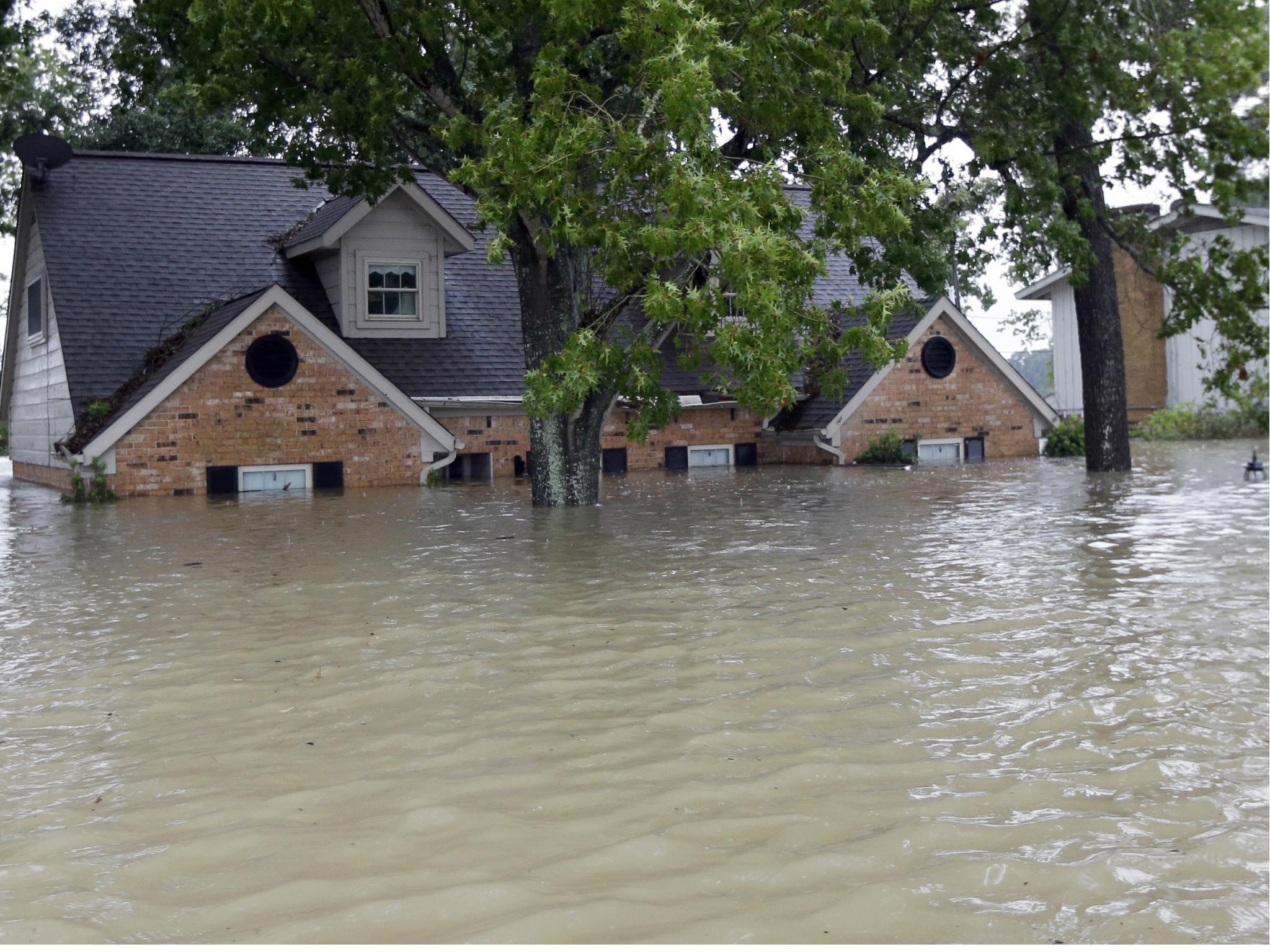 A Houston home is surrounded by floodwaters from Tropical Storm Harvey