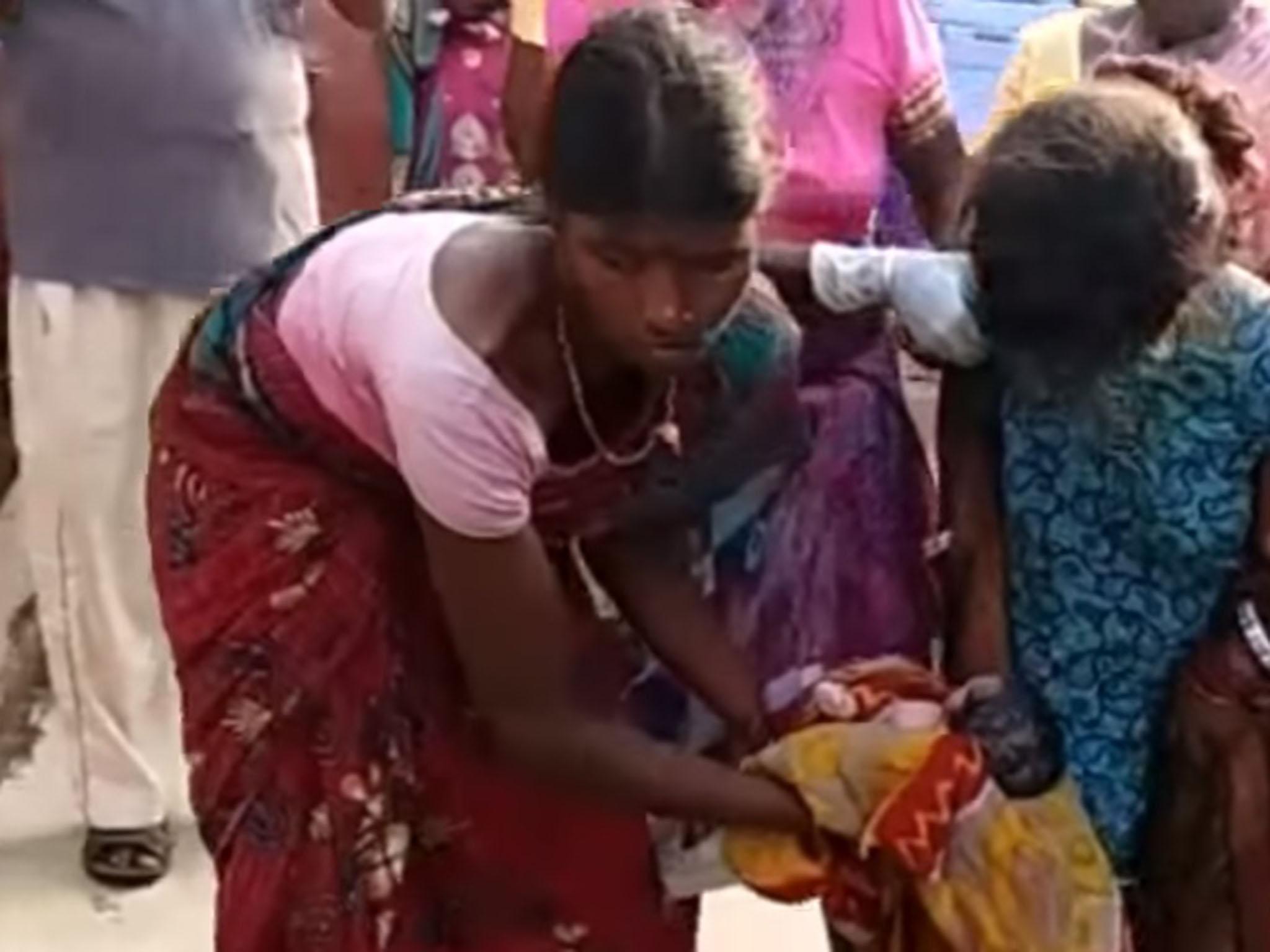 The unnamed girl shortly after giving birth on the street in Chandil, in India's state of Jharkhand