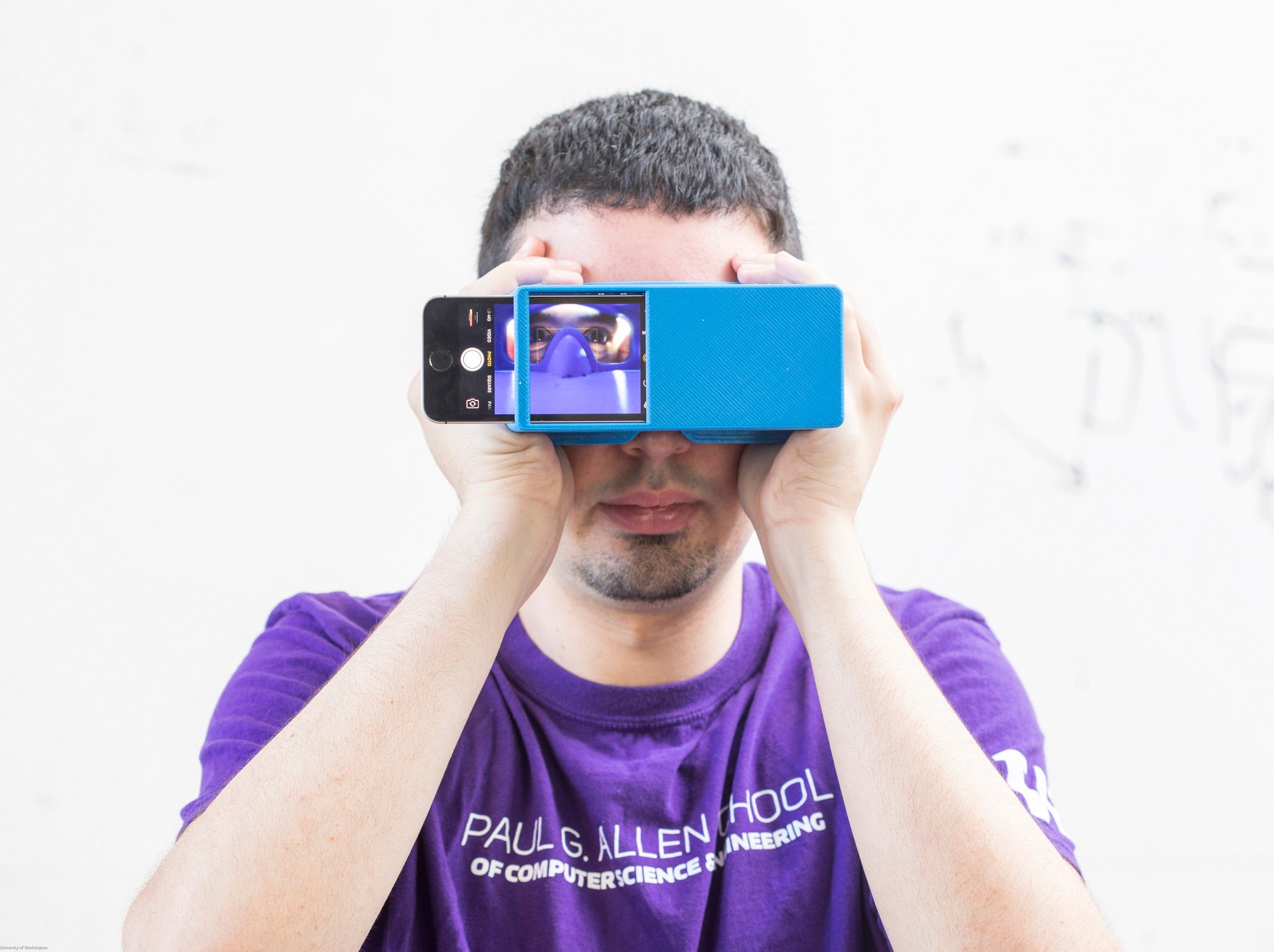 Users, wearing specially designed paper glasses or holding a 3D-printed box, take a selfie using their smartphone