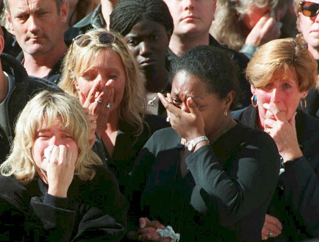 Spectators weep in the crowd along London’s Whitehall during funeral ceremonies for Diana