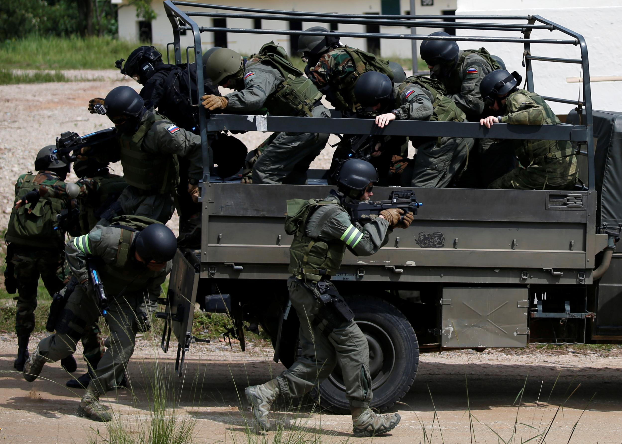 A Special Forces Task Group prepare to storm a building during an exercise involving South Korea