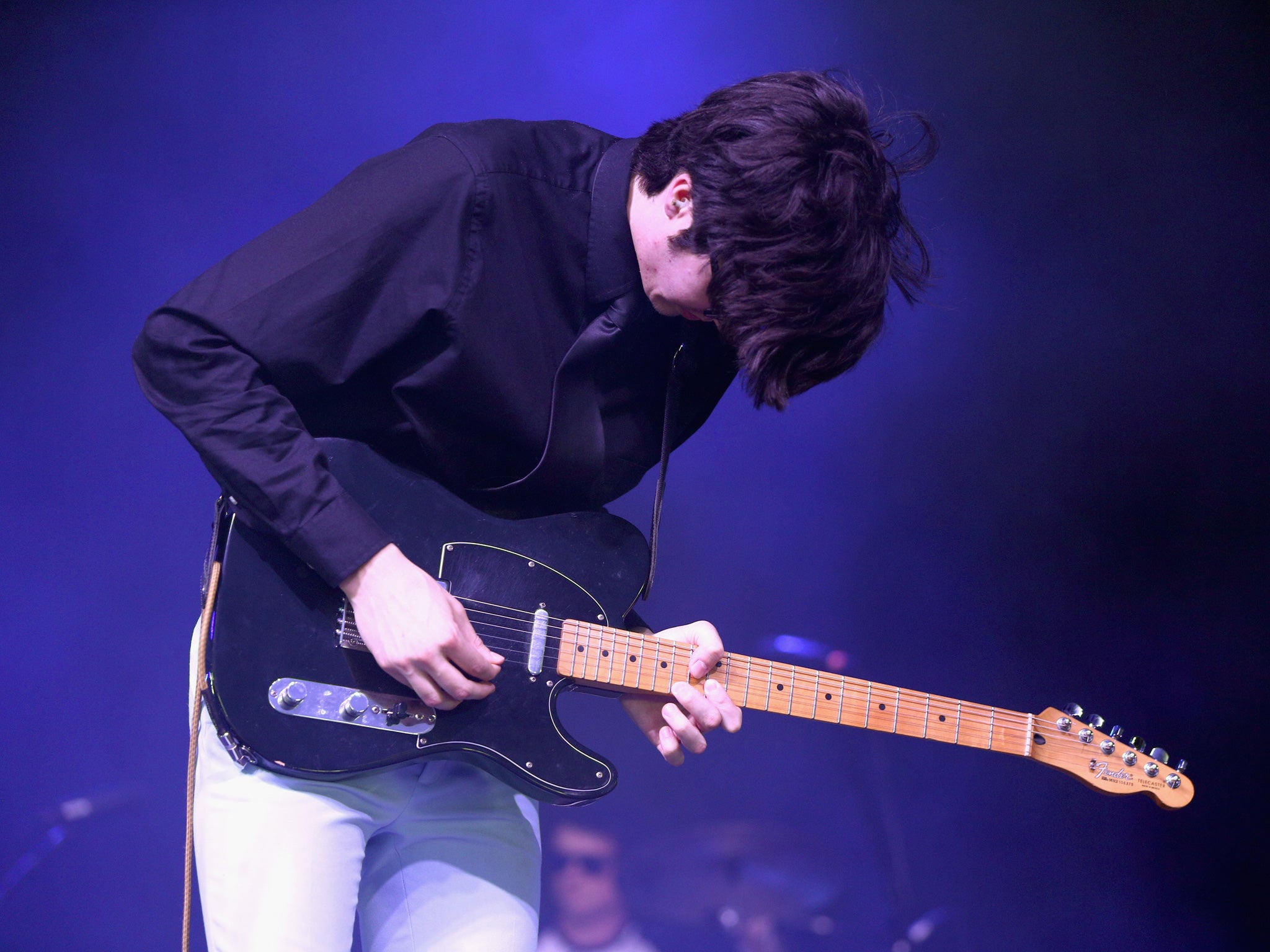 Pretty much every one of Toledo’s guitar solos is performed with his back to the audience, crouched over by the amp, but it’s all part of the appeal