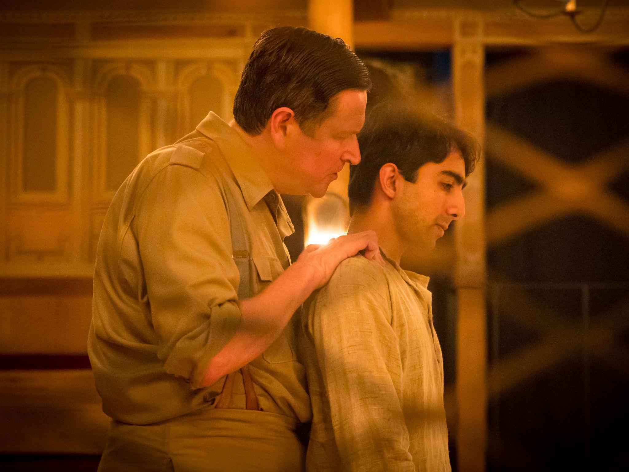 Jonathan Keeble as Executioner and Shubham Saraf as Dinesh Gupta in 'Lions and Tigers' at the Sam Wanamaker Playhouse