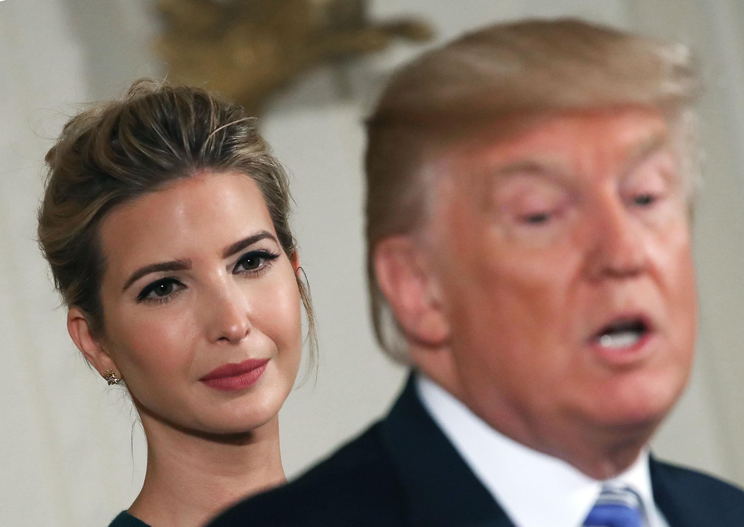 President Donald Trump speaks about small businesses while daughter and advisor to the President Ivanka Trump listens