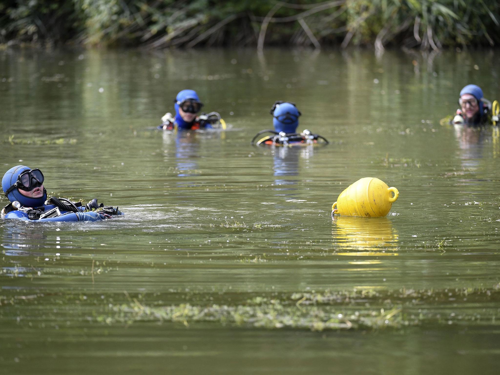 Divers of the French gendarmerie have been searching for evidence in a nearby pond near (AFP/Getty)