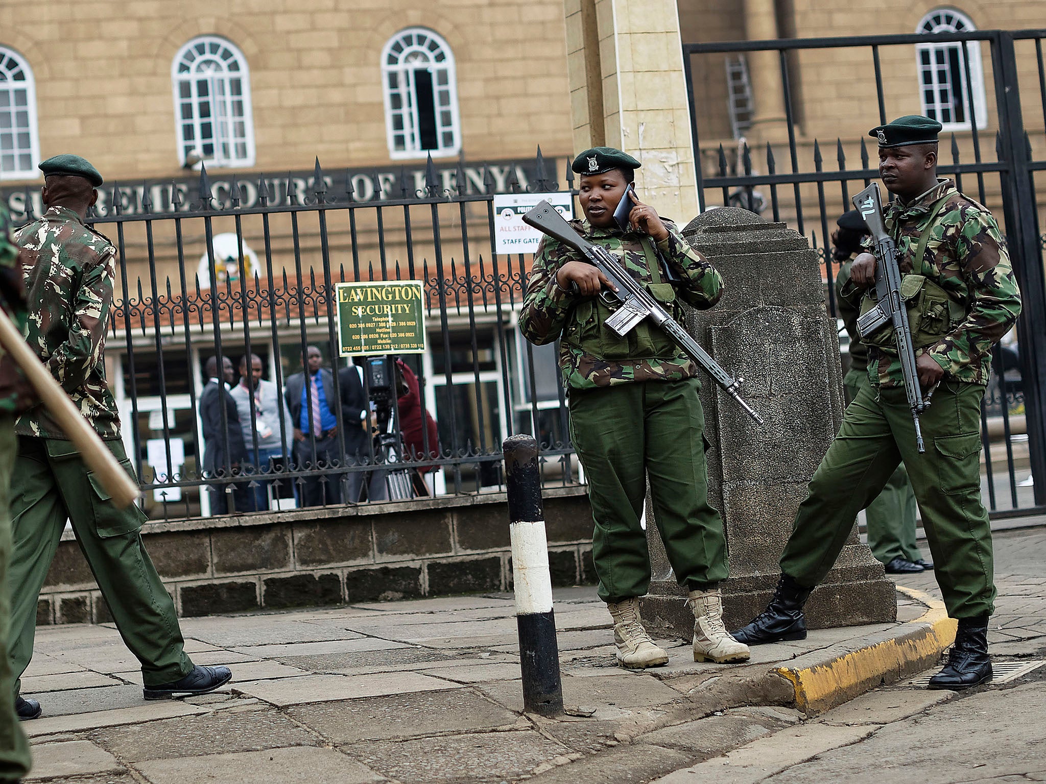 Police outside the Supreme Court building where the verdict was delivered. Officers have been sent out to areas of Nairobi in anticipation of unrest