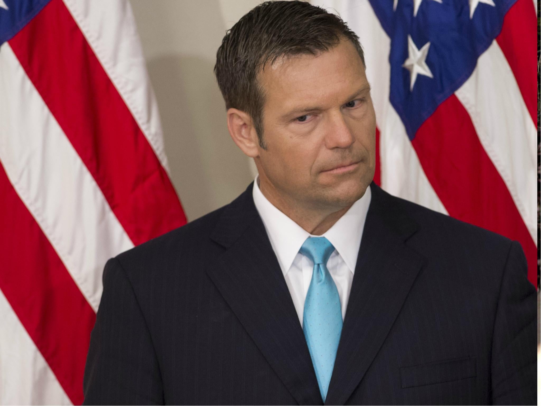 Kansas Secretary of State Kris Kobach is the head of Donald Trump's election fraud commission and also a paid columnist for right-wing Breitbart News