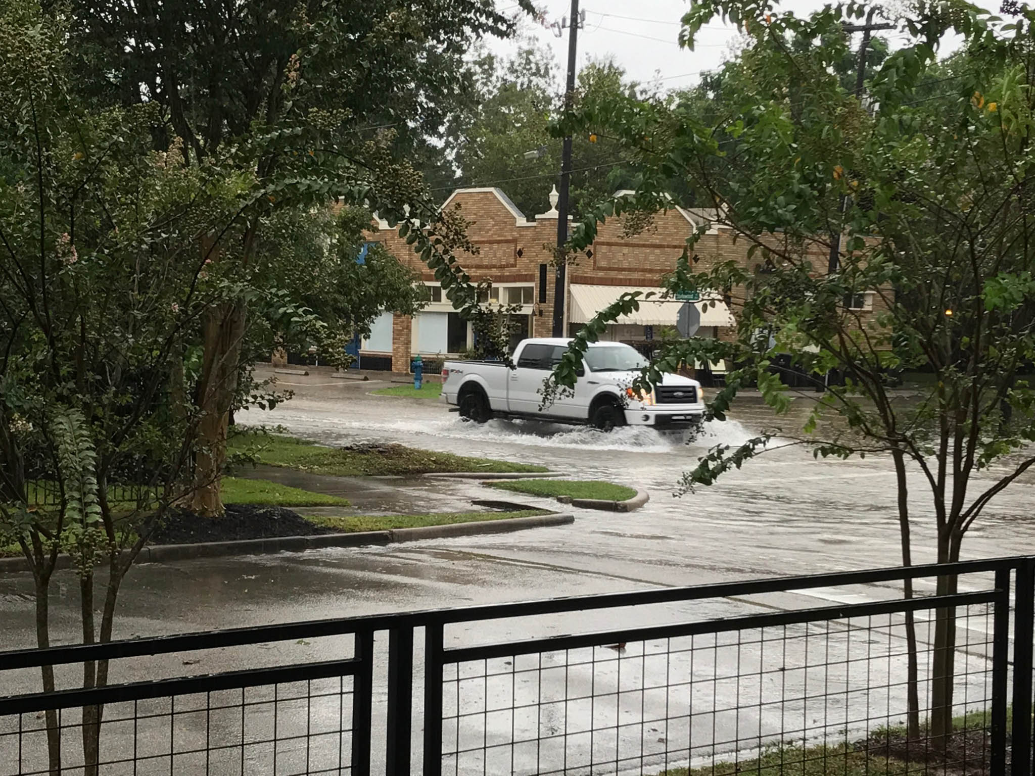 As the flooding subsided in The Heights, some larger vehicles could get through the water