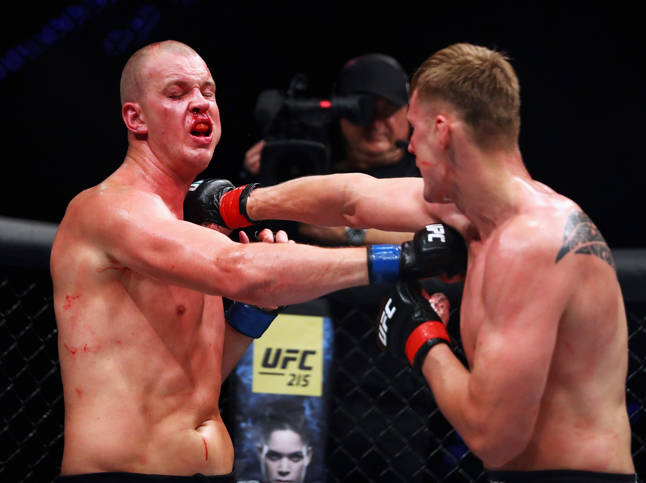 Alexander Volkov of Russia hits Stefan Struve of the Netherlands