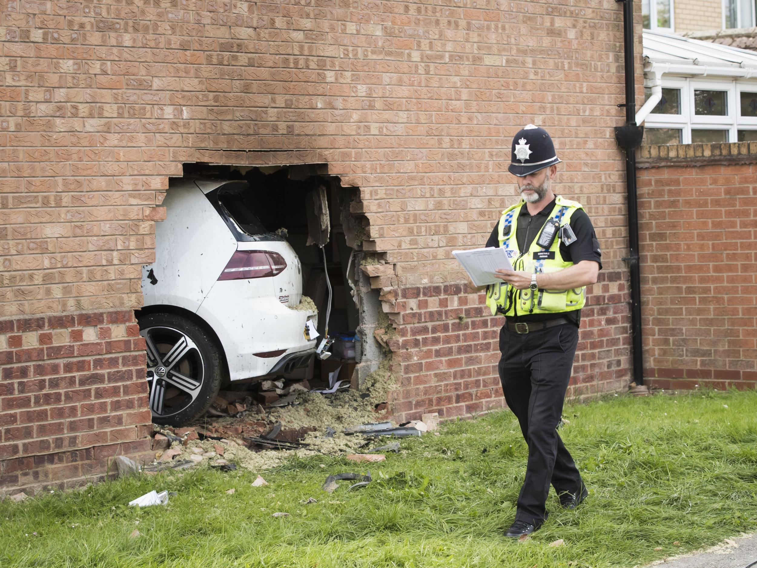 A man in his twenties, believed to be the driver of the car, has been arrested in connection with the incident. He sustained minor injuries in the collision and was taken to hospital. The two other people were in the car at the time also received medical attention. A woman who was in the house was uninjured. (PA)