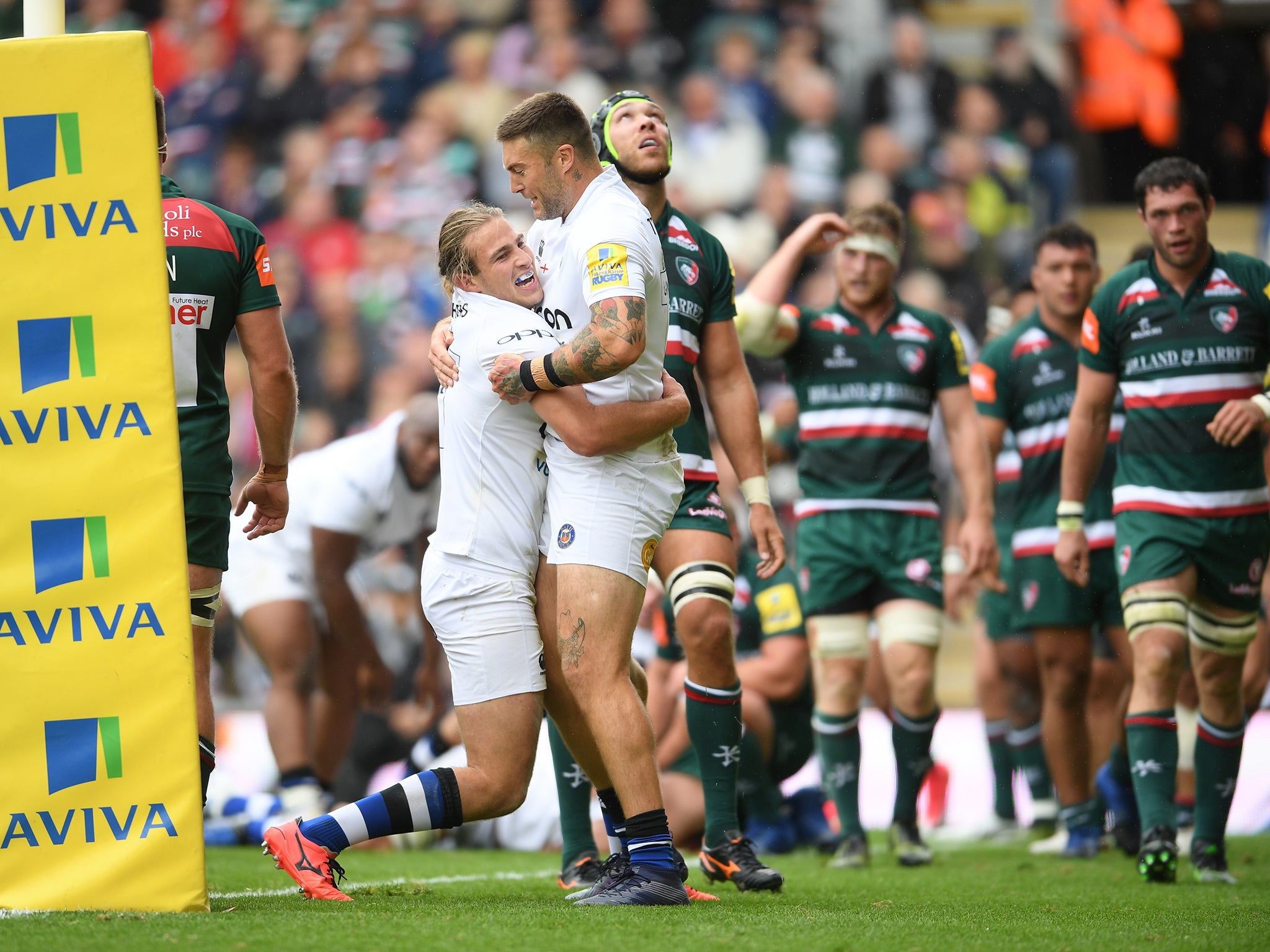 Bath's Max Clark celebrates with Matt Banahan after scoring a try against Leicester