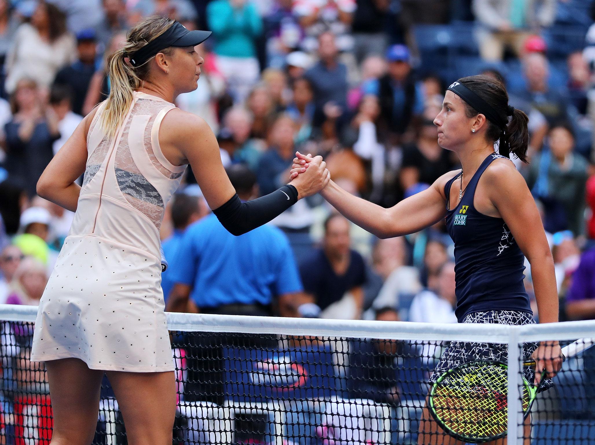 &#13;
Sharapova congratulates Sevastova after their two and a quarter hour contest &#13;