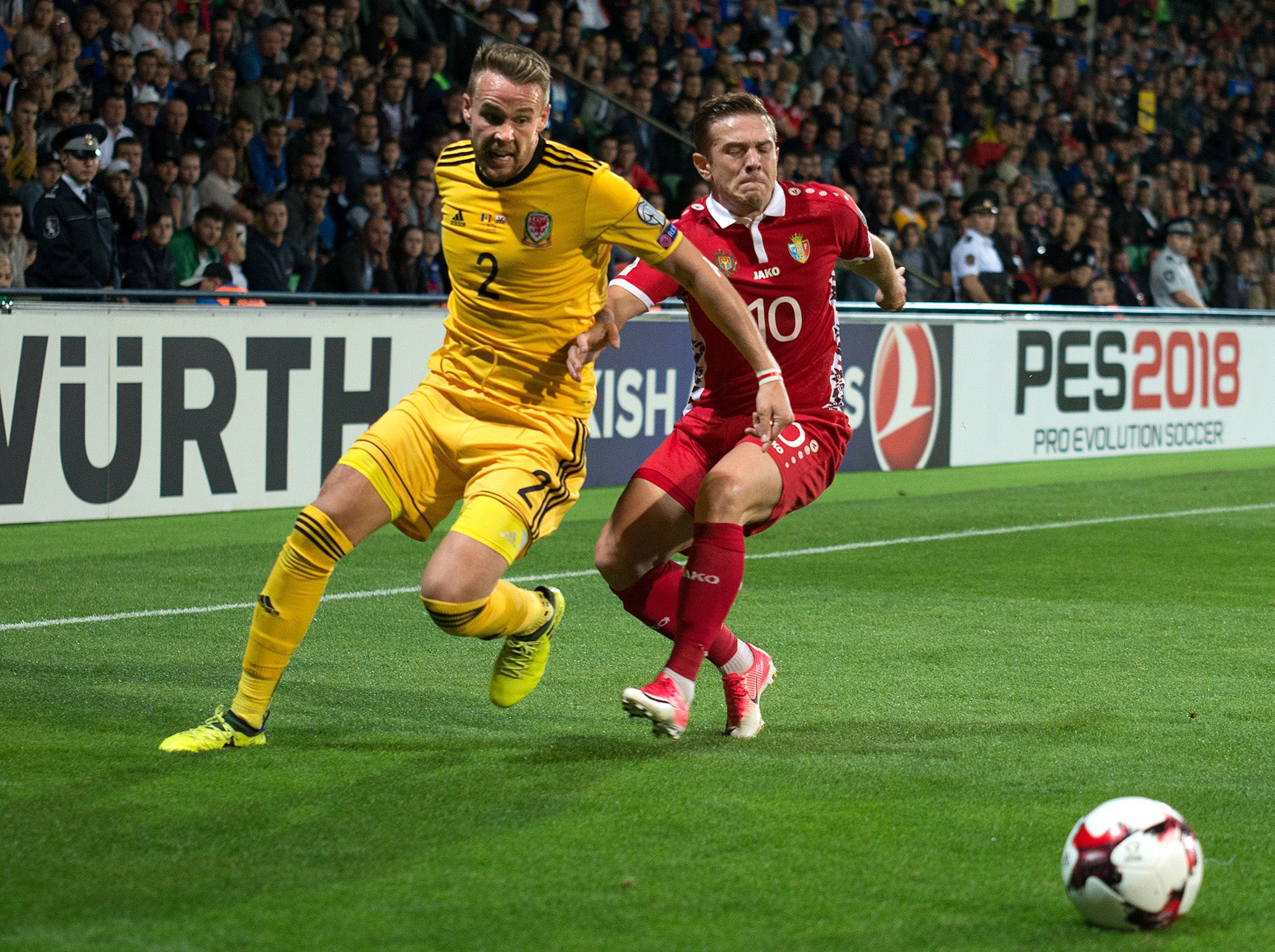 Chris Gunter and Alexandru Dedov vie for the ball