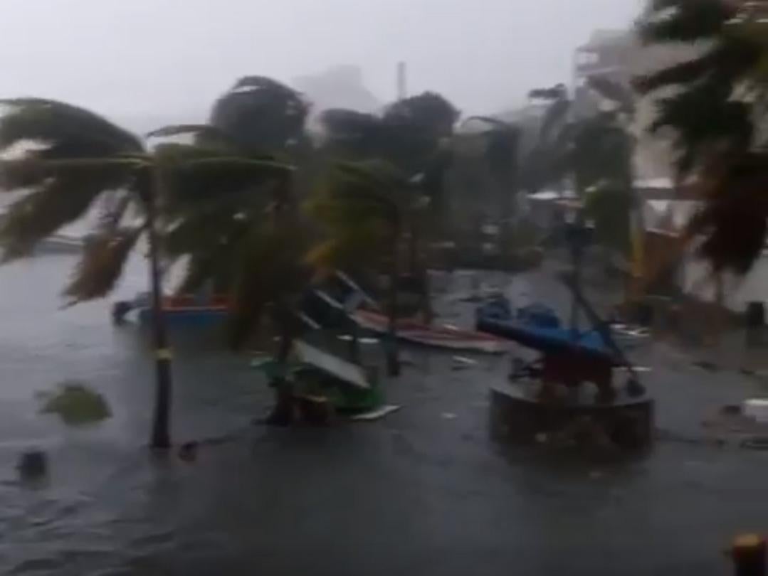 Floodwater sweeps away debris in Philipsburg, Saint Martin