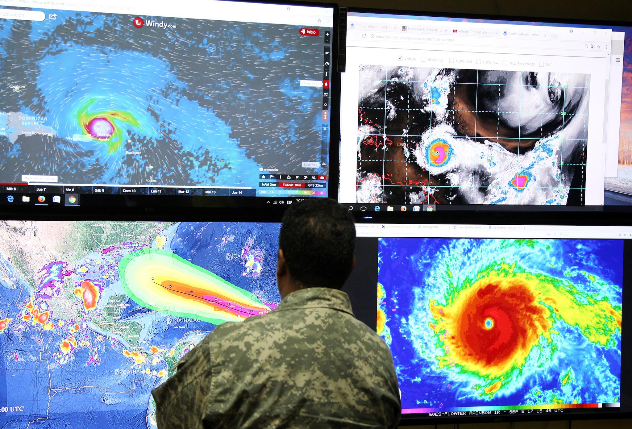 A member of the Emergency Operations Committee (COE) monitors the trajectory of Hurricane Irma in Santo Domingo, Dominican Republic September 5, 2017