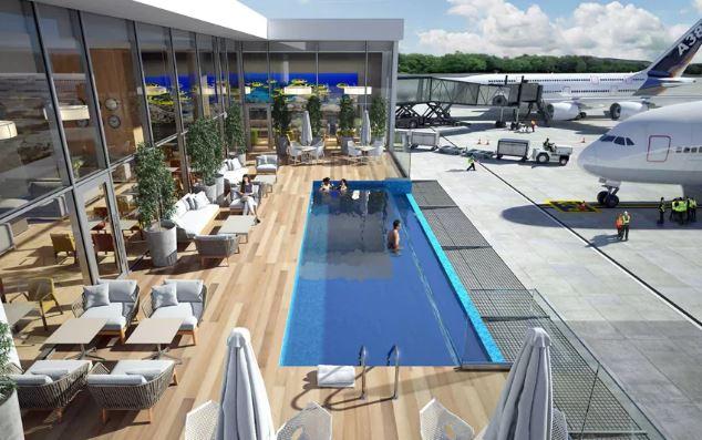 The outdoor pool will overlook the runway