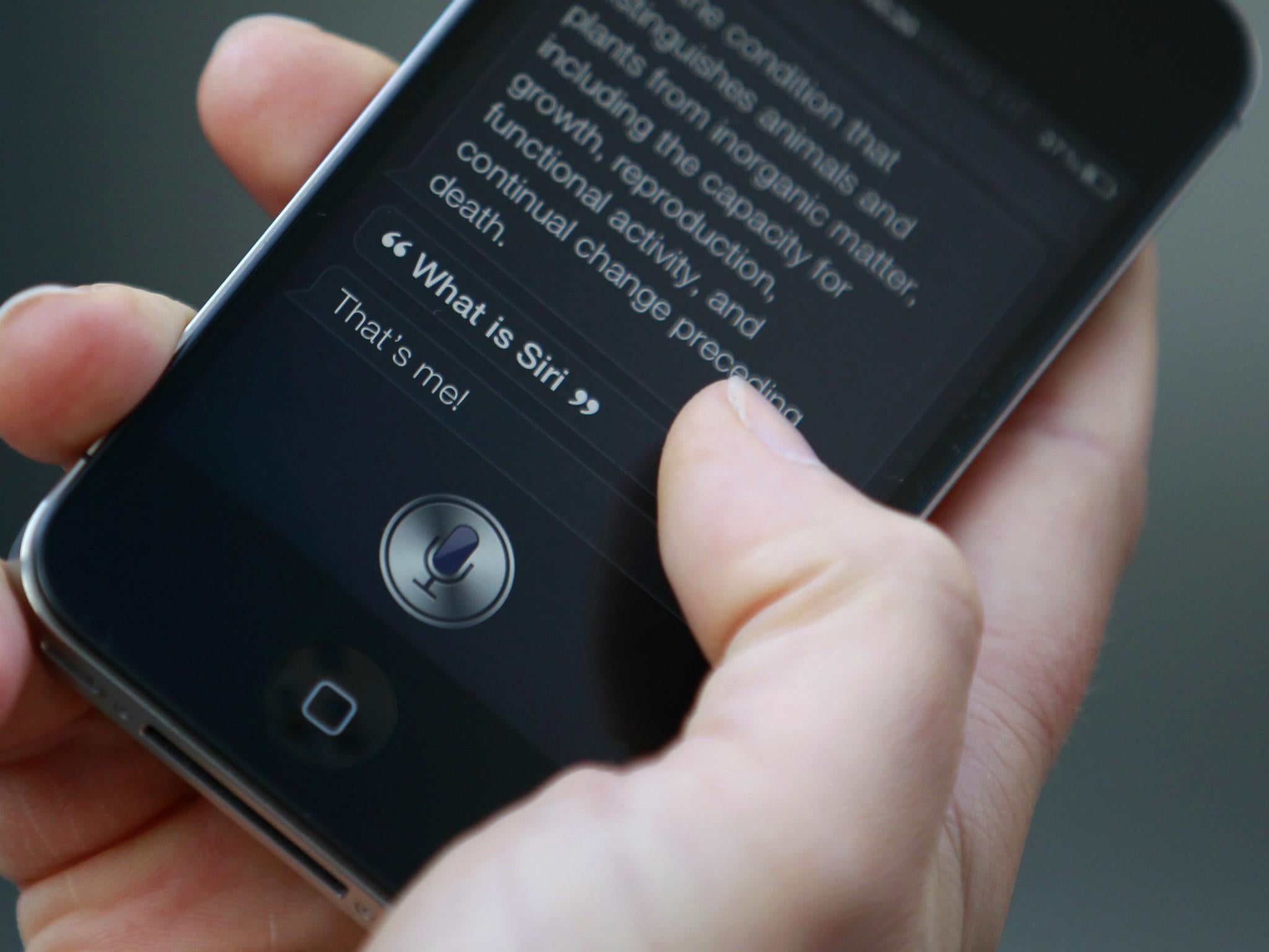 Luke Peters demonstrates Siri, an application which uses voice recognition and detection on the iPhone 4S, outside the Apple store in Covent Garden, London October 14, 2011