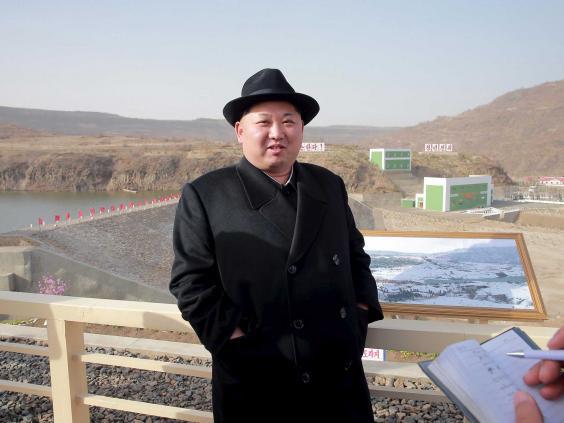 KJU rocking the despotic half-eyebrow, teamed with a murderous fedora