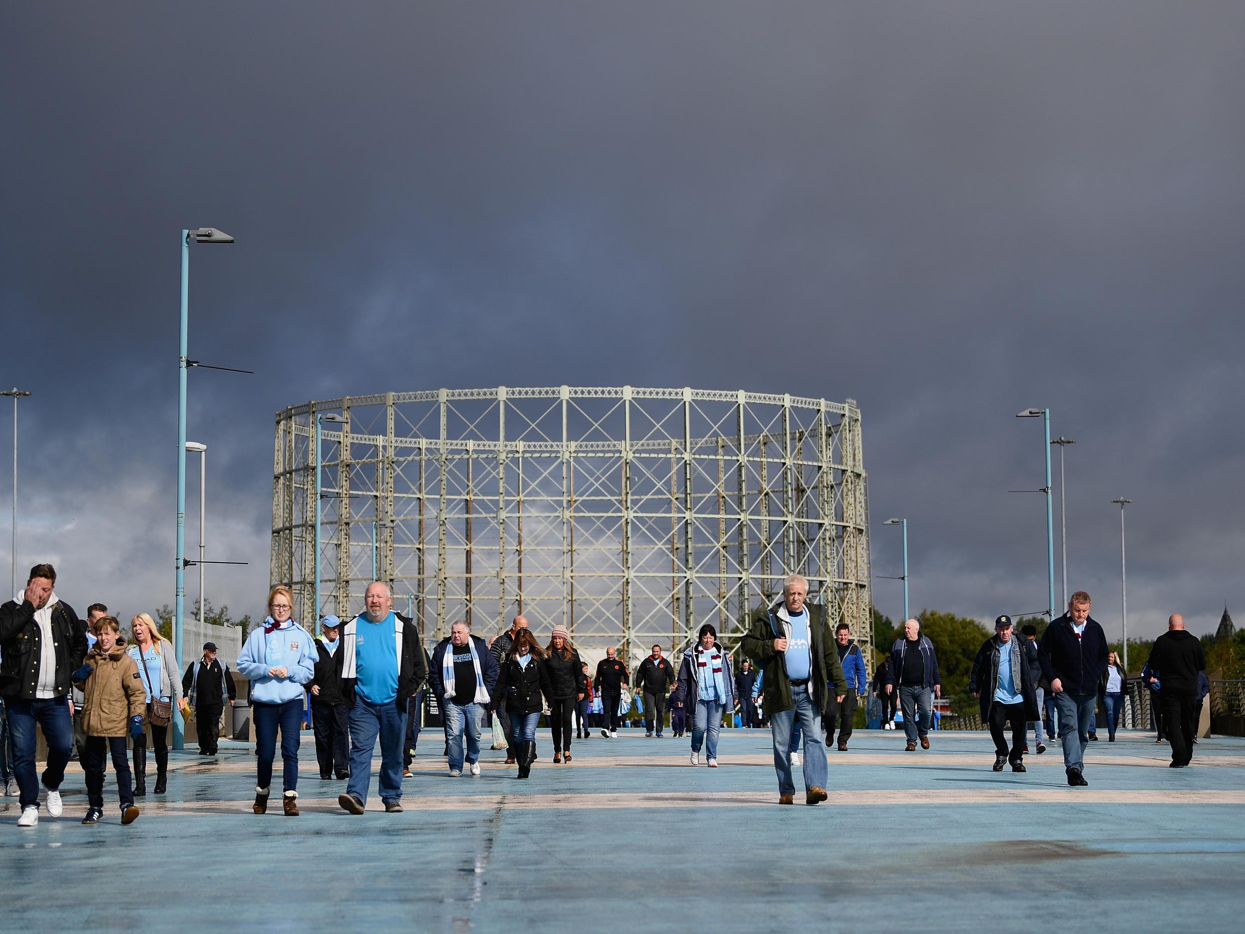 Fans make their way to the Etihad Stadium