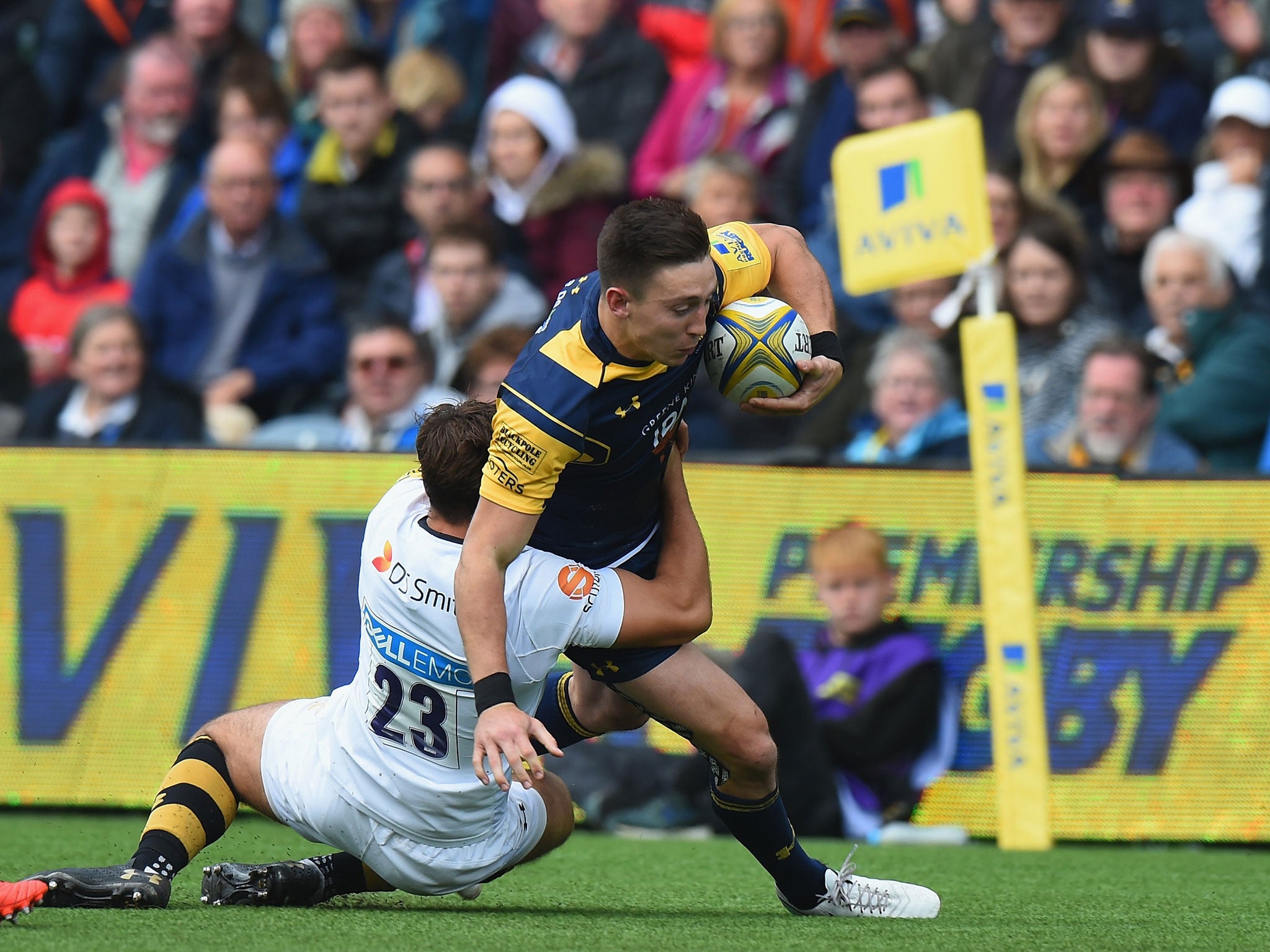 Josh Adams is tackled by Rob Miller