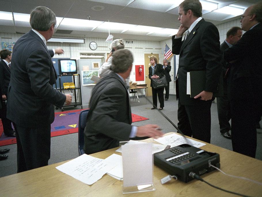 President George Bush reacts to TV news footage of the second plane hitting the Twin Towers