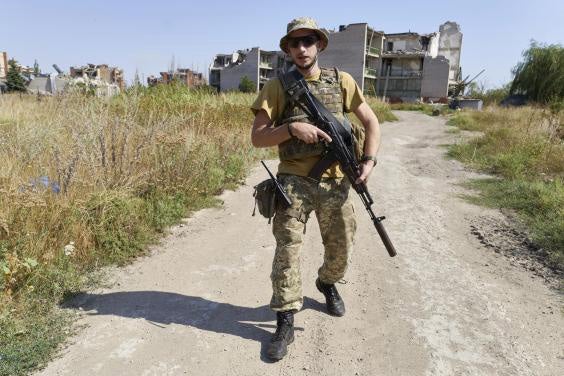 &#13;
A Ukrainian serviceman in Shyrokyne, a resort town that has been reduced to rubble after two and half years of artillery fire between Russia-backed separatists and Ukrainian forces &#13;