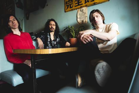 Virgil Howe (centre) has died unexpectedly aged 42