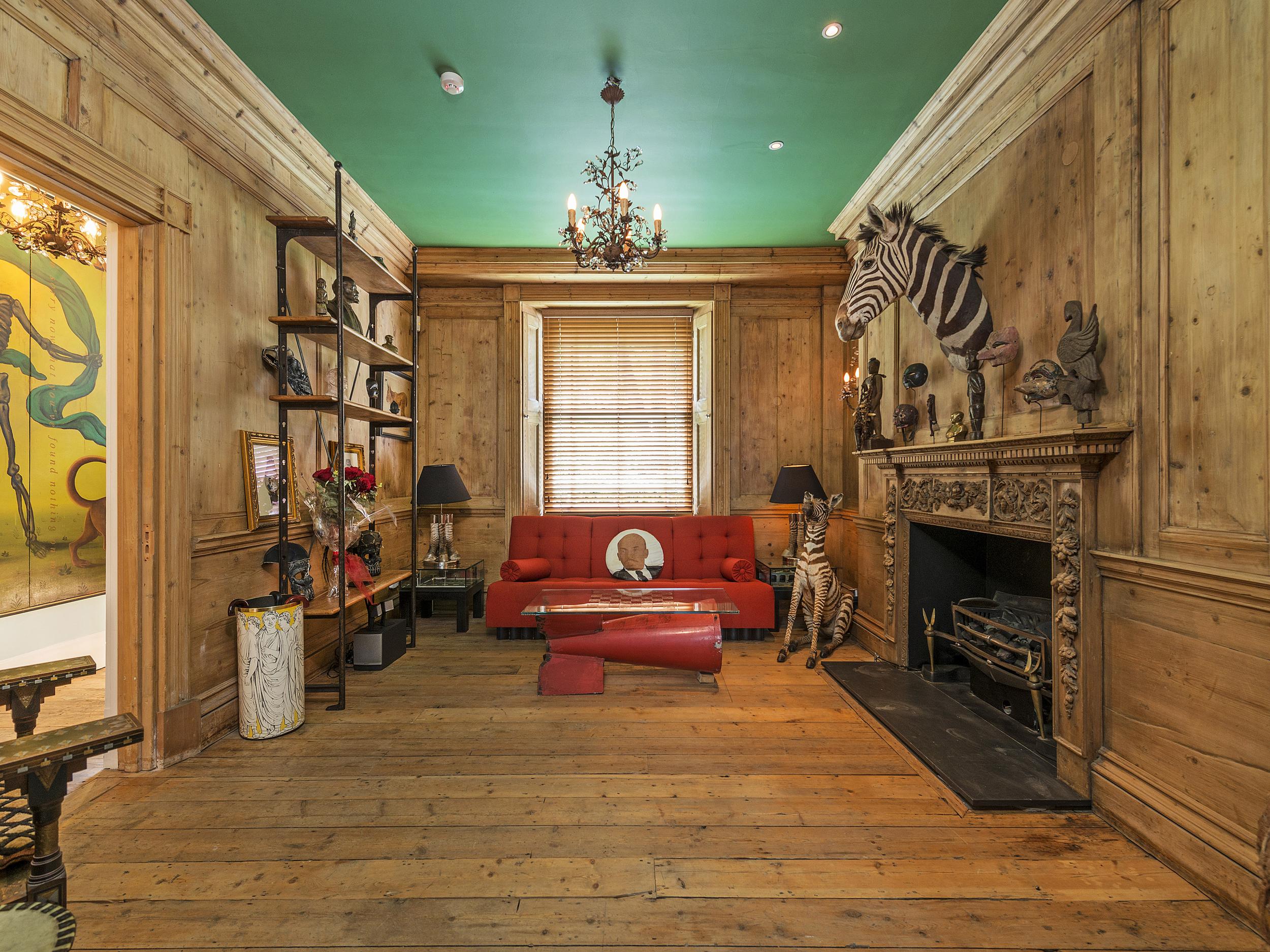 Lenin appears on multiple cushions around the house alongside stuffed animals (Kinleigh, Folkard &amp;amp; Hayward)