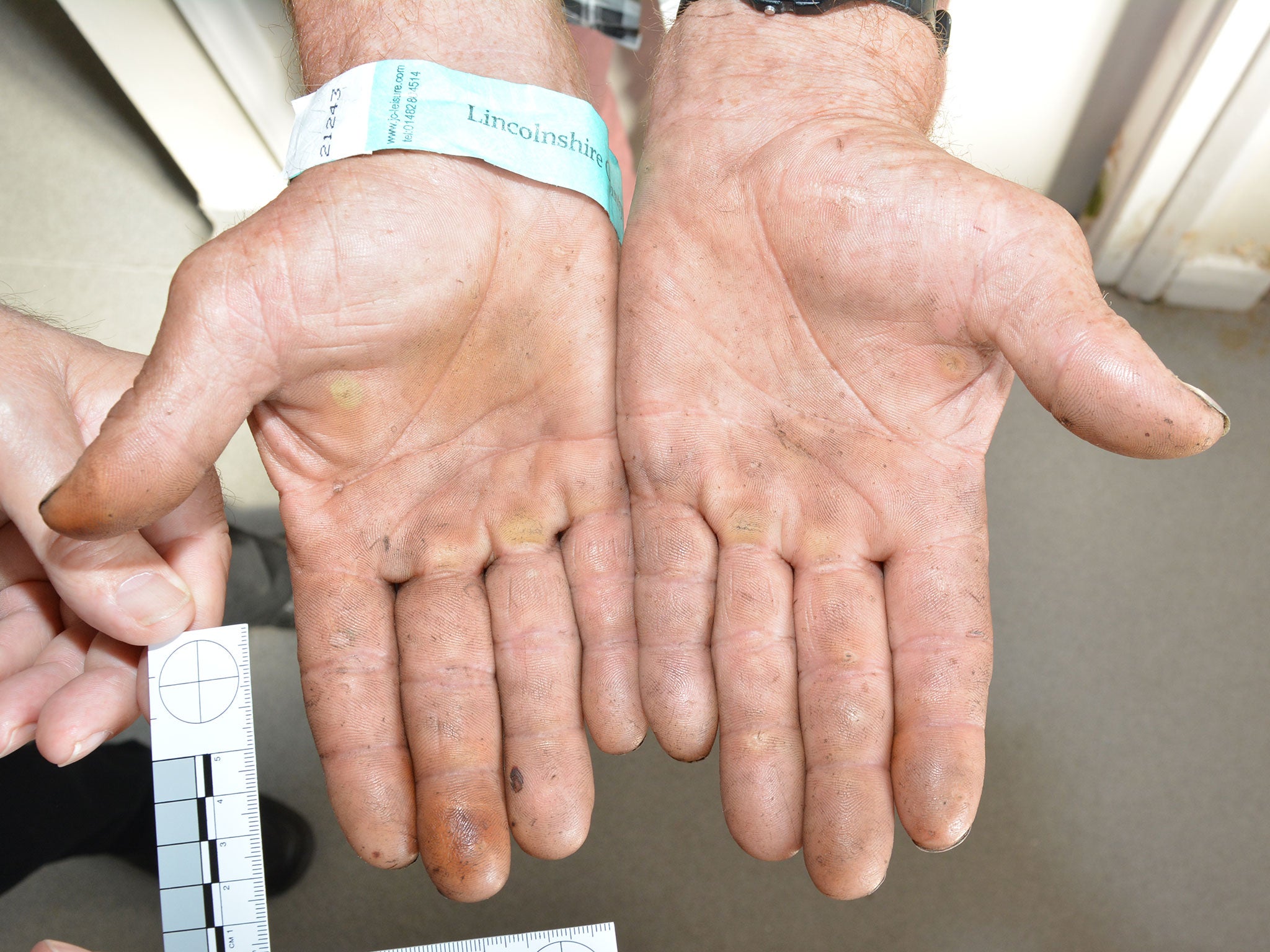 The hands of one of the Rooney family's victims