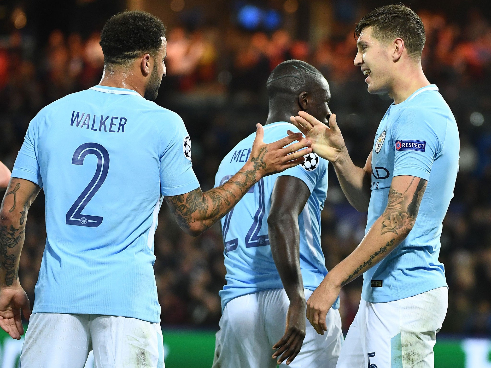 John Stones celebrates his second goal with Kyle Walker