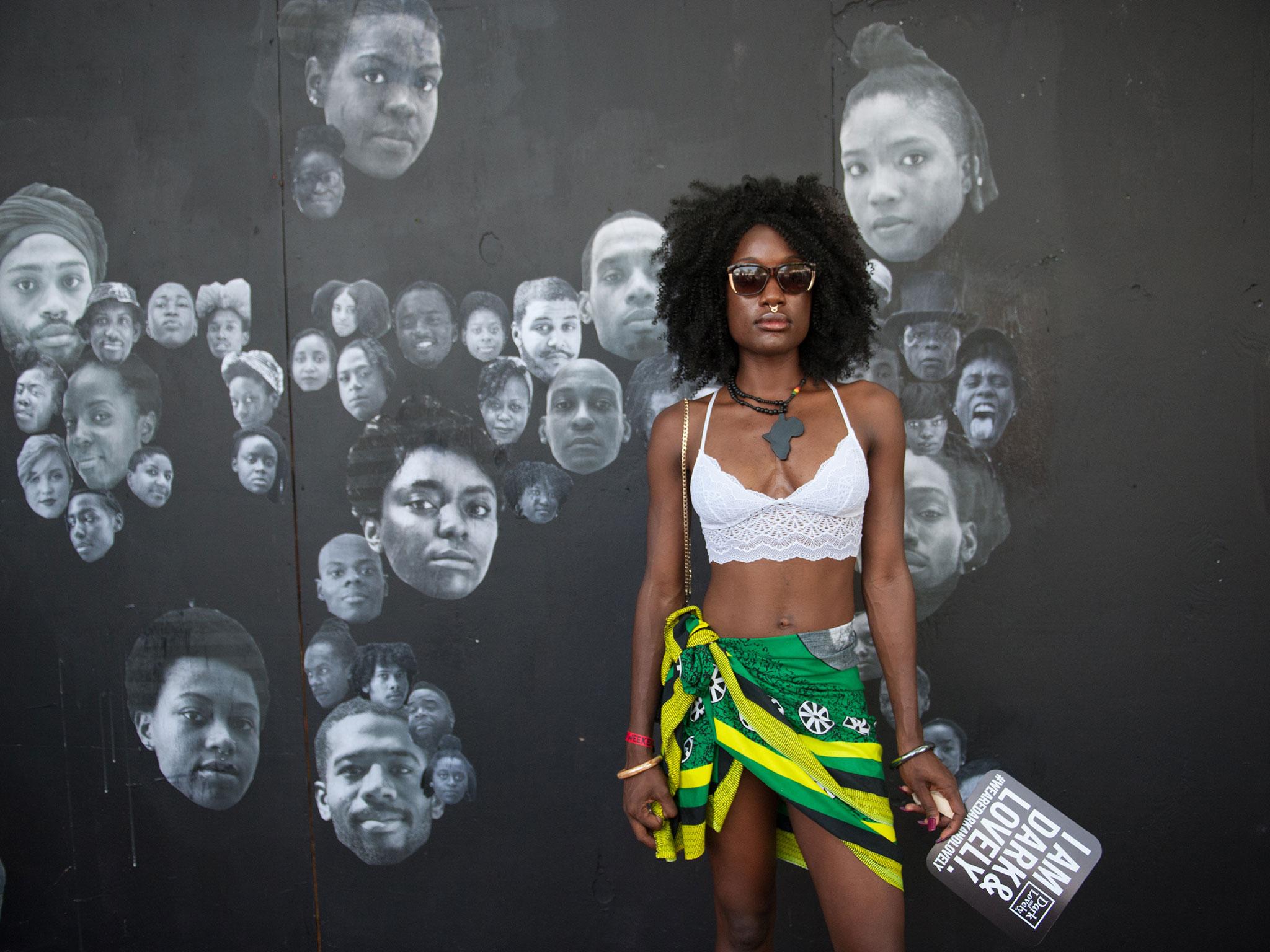 A woman with Afro hair pose at the Afropunk music festival in New York