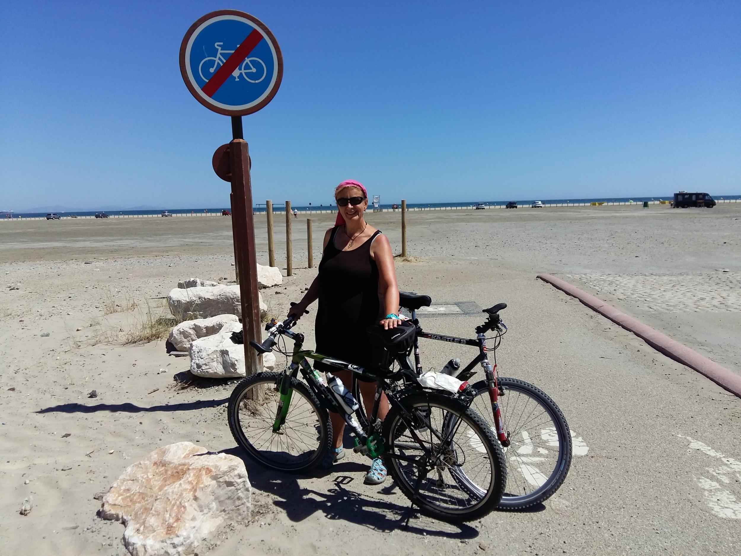 Zuzana minds the bikes at Plage Napoleon (Zuzana and David Cox)