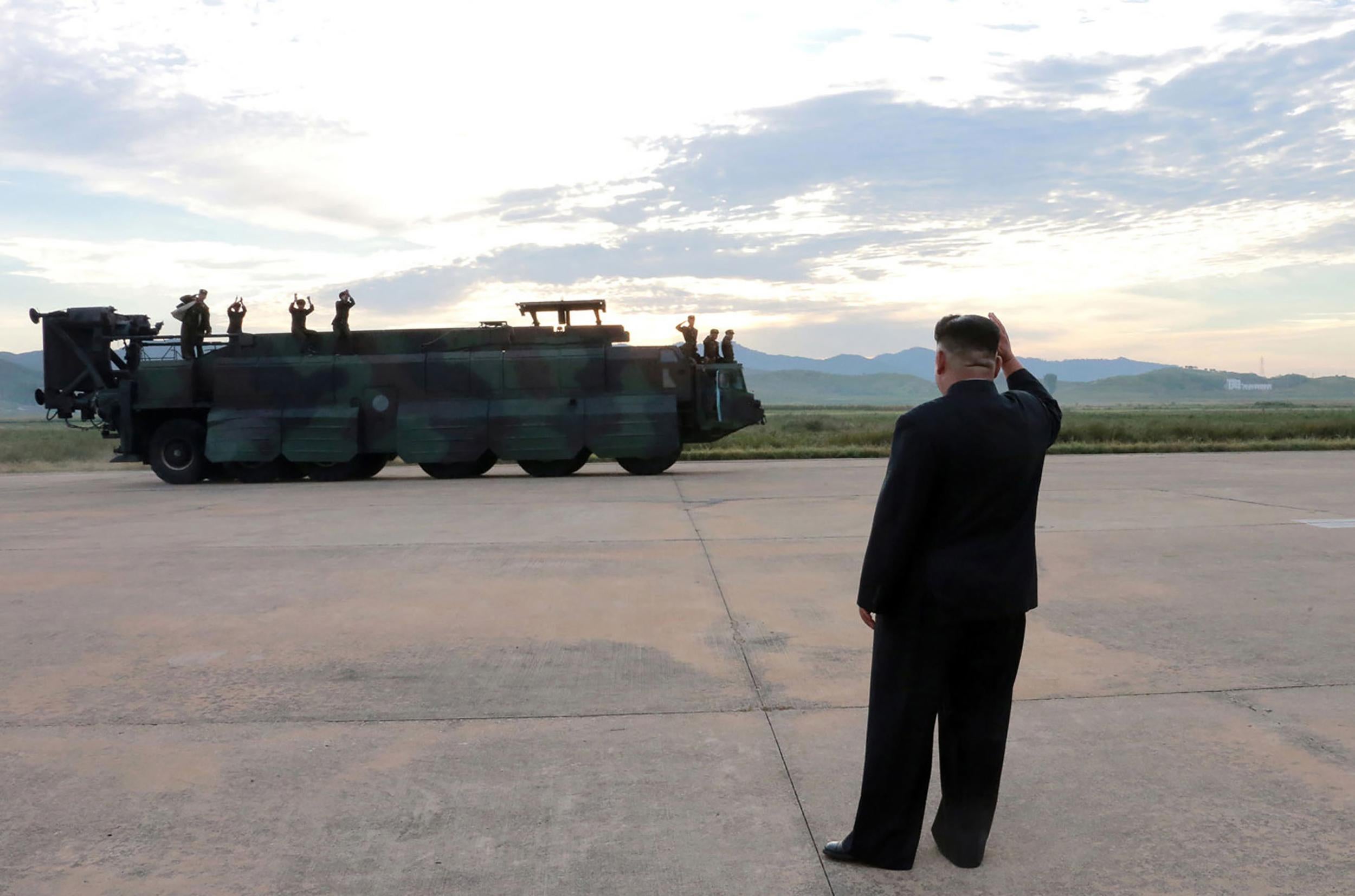 In an unverified image released by North Korea's news agency, Kim Jong-un is shown inspecting a launching drill of the medium-and-long-range strategic ballistic rocket Hwasong-12