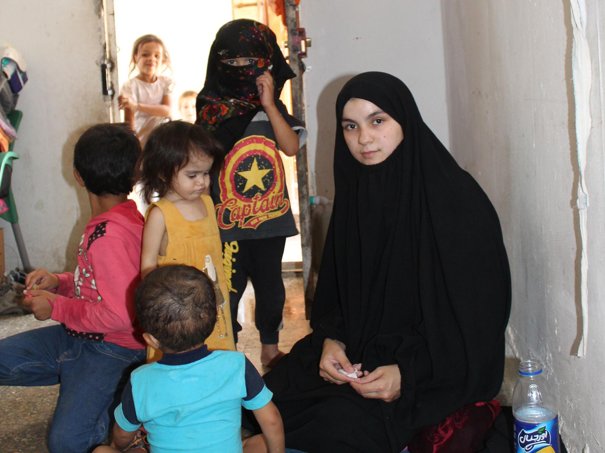 Nour and her children in the Syrian displaced persons camp. They will soon return to her native Lebanon